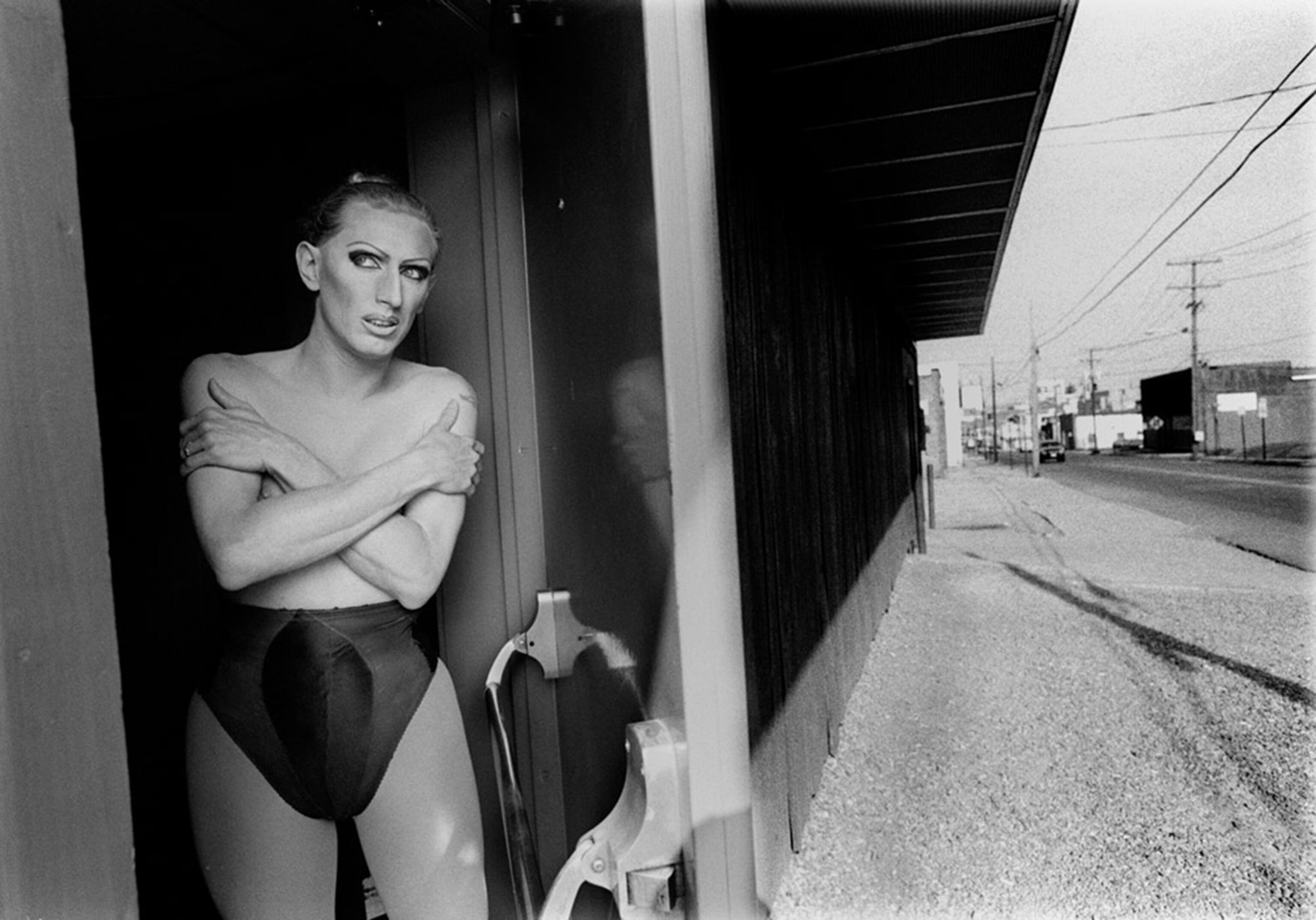 drag queen, Thomas. He's dressing for a show, in transition between male and female