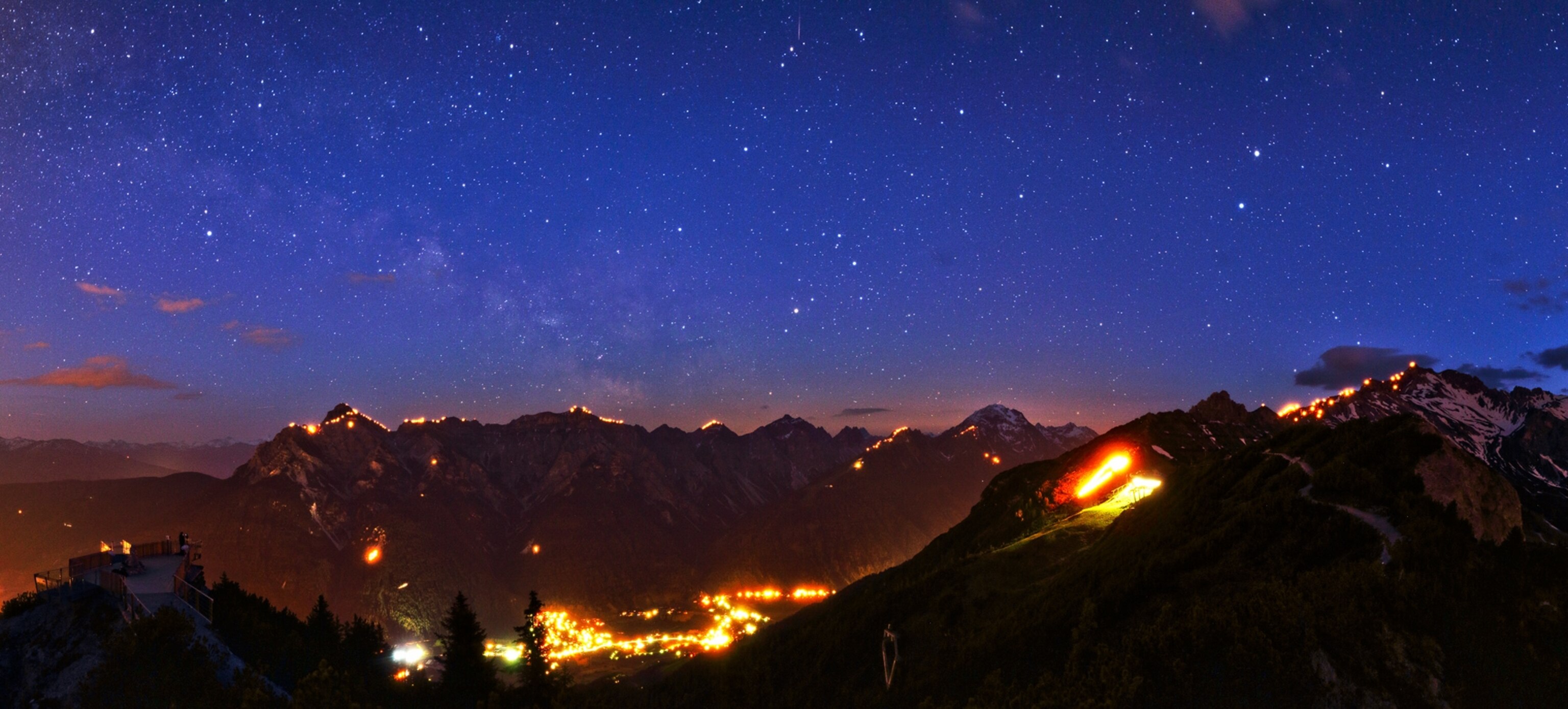 The World at Night - A picture of mountains silhouetted against the night sky.