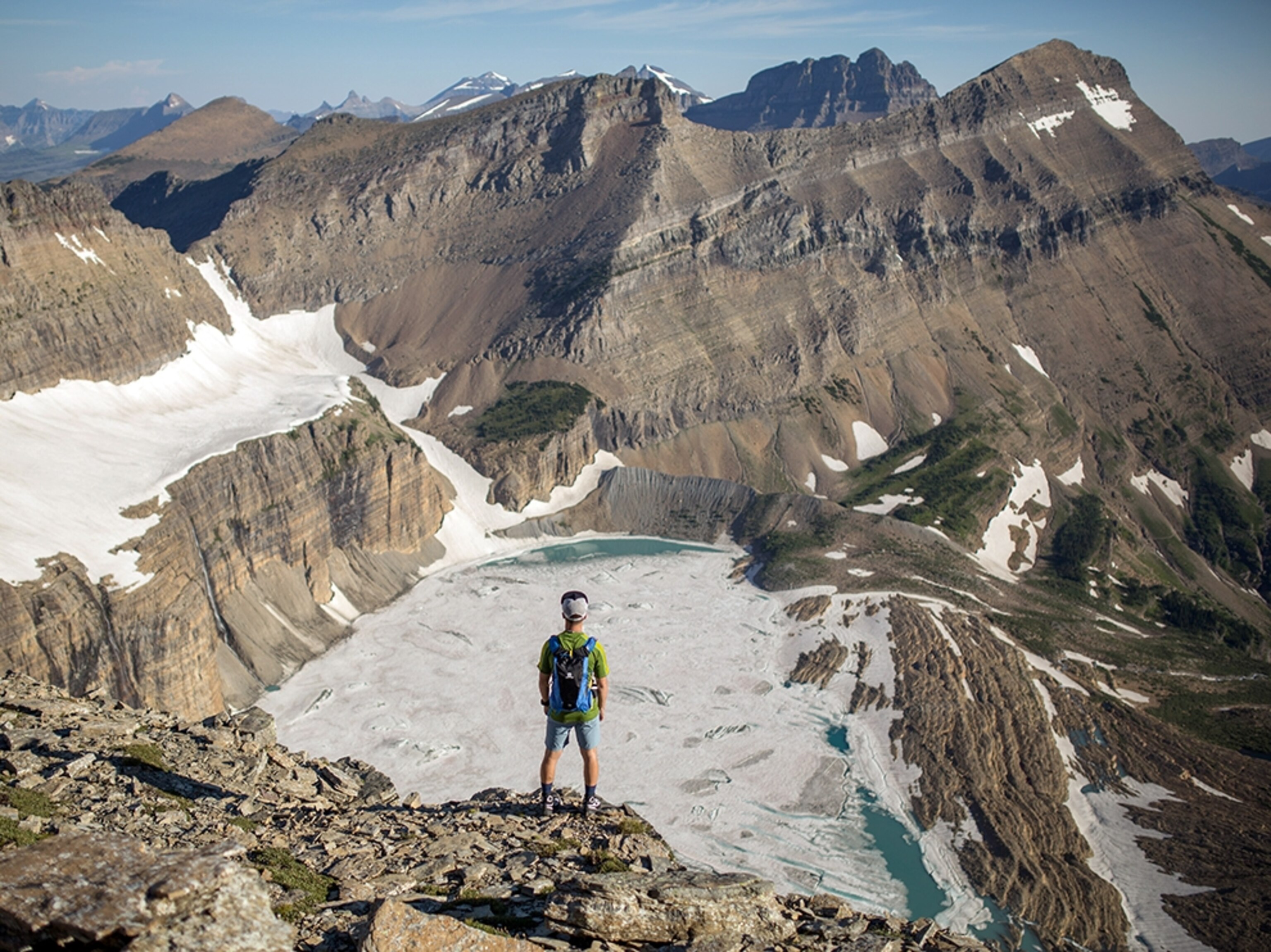 a hiker viewing Salamander Glacier in Montana