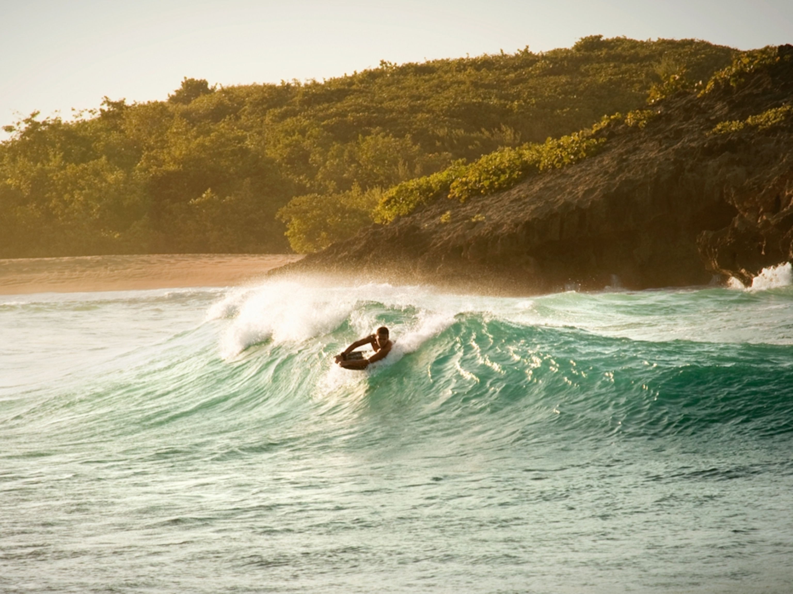 Surfer on large wave