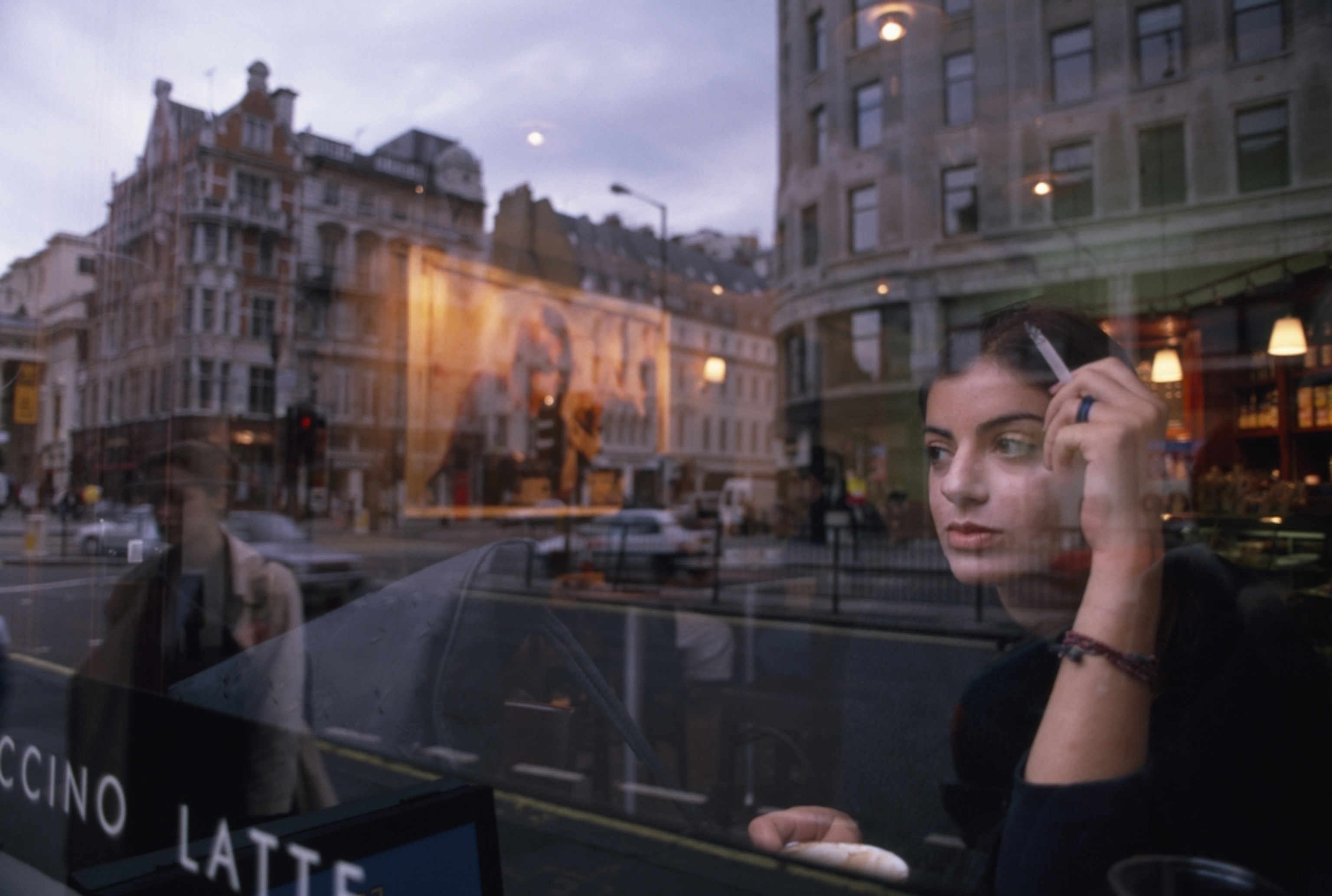 a woman in a coffee shop window, London