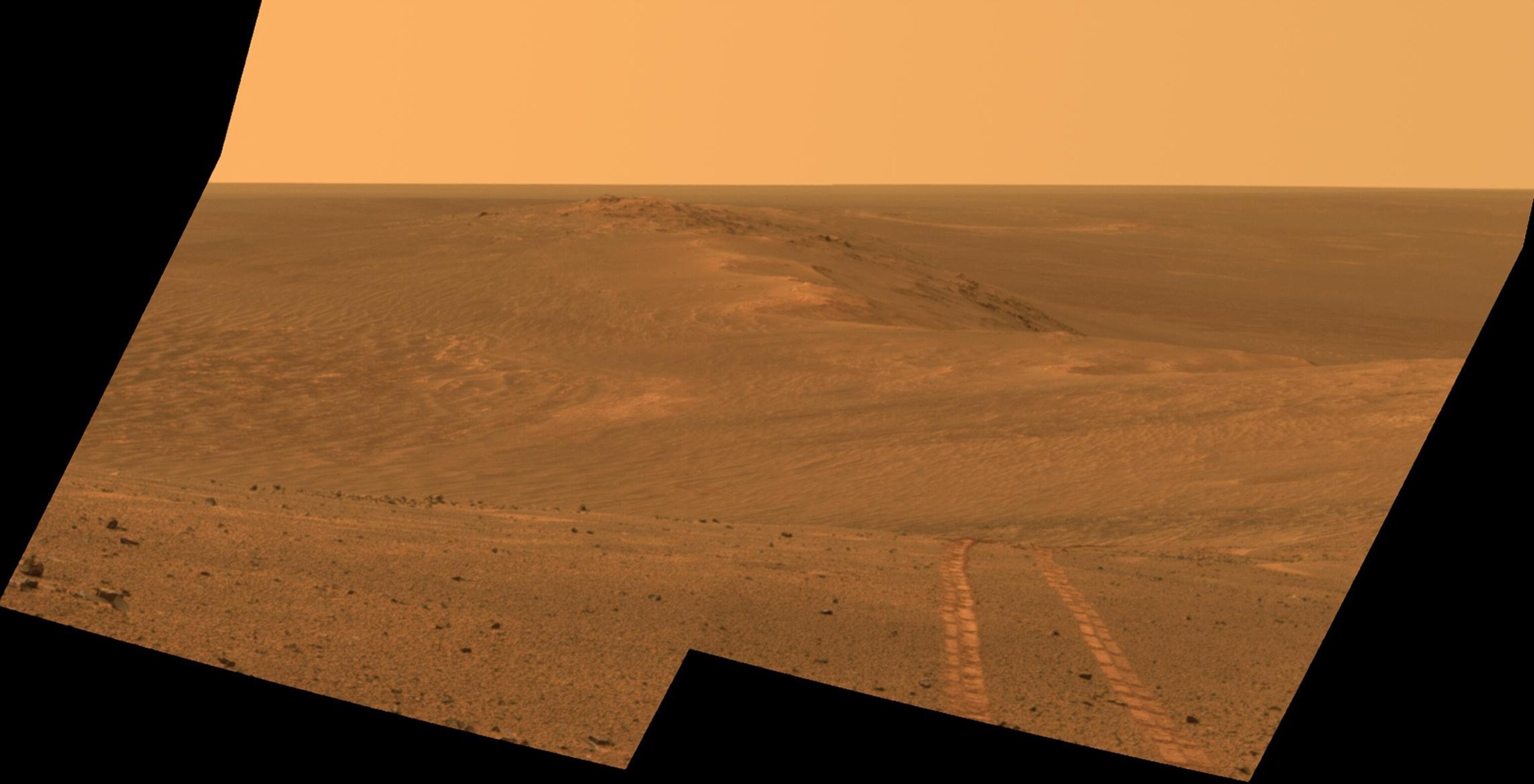 Mars rover tracks in Northward view along west rim of Endeavour Crater.