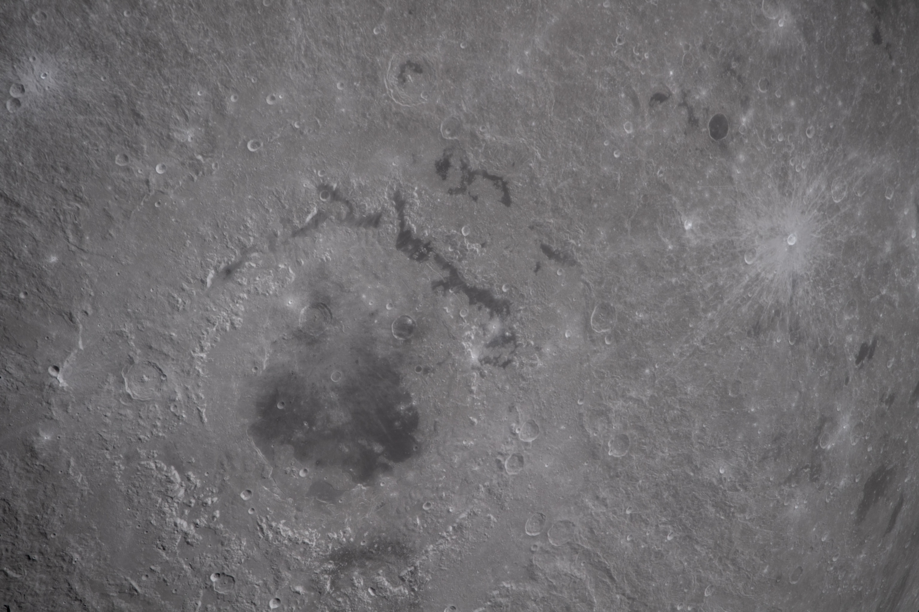 In this view of the Moon, the Artemis II crew captured an intricate snapshot of the rings of the Orientale basin, one of the Moon’s youngest and best-preserved large impact craters on his first shift during the lunar flyby observation period.