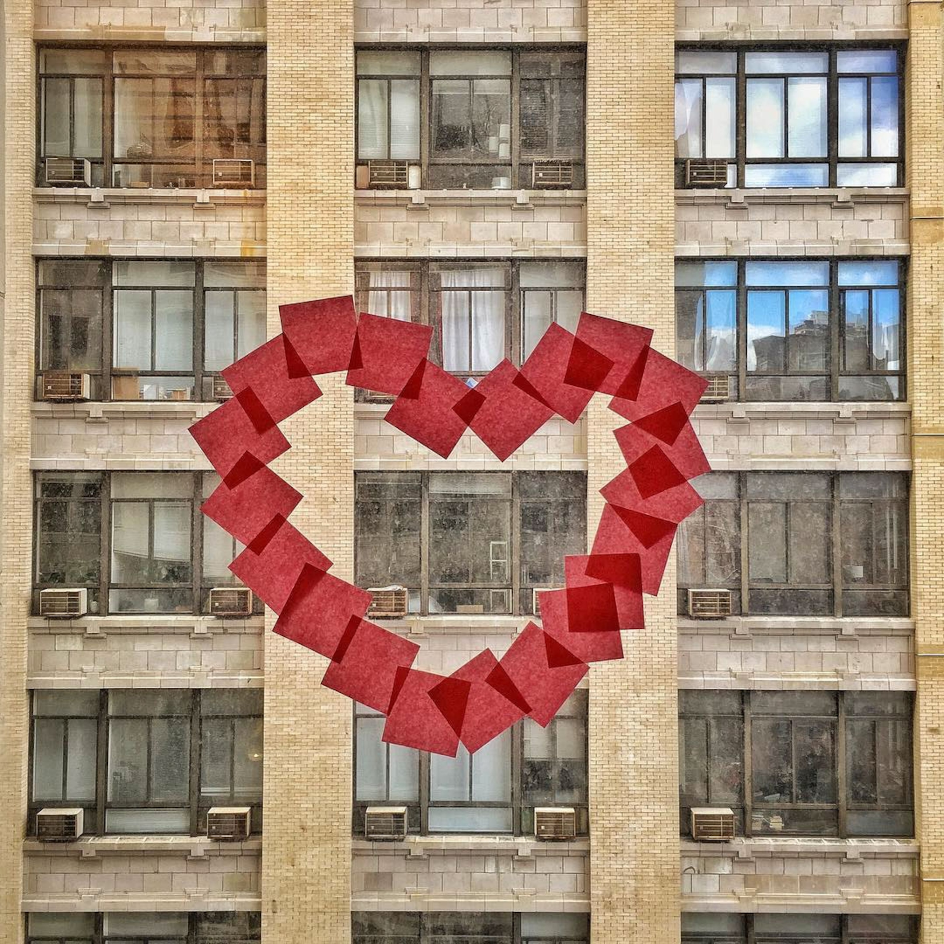 a heart made out of Post-it notes