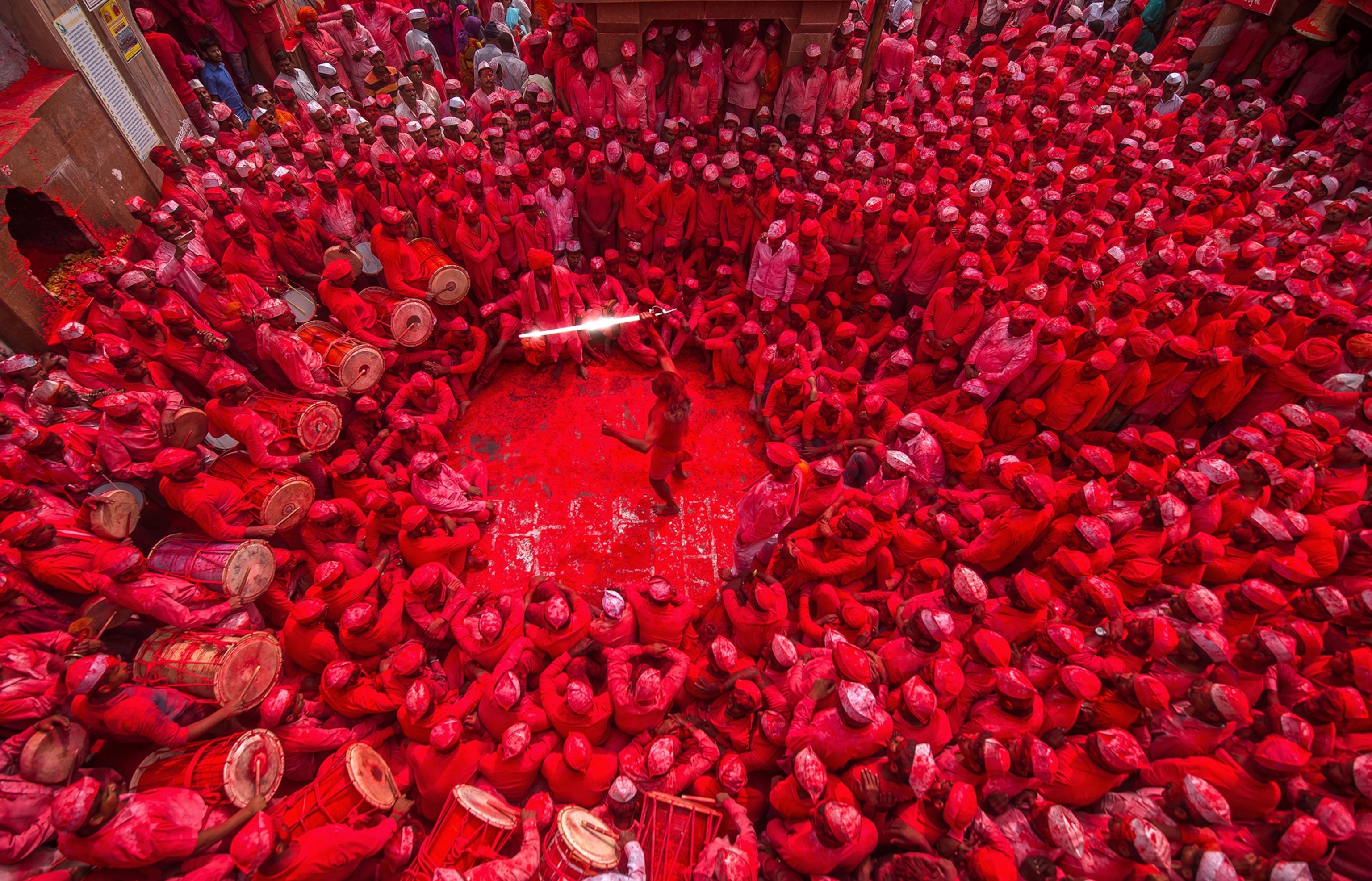 a man surrounded by a crowd near the Shri Nath Mhaskoba temple, Maharashtra, India