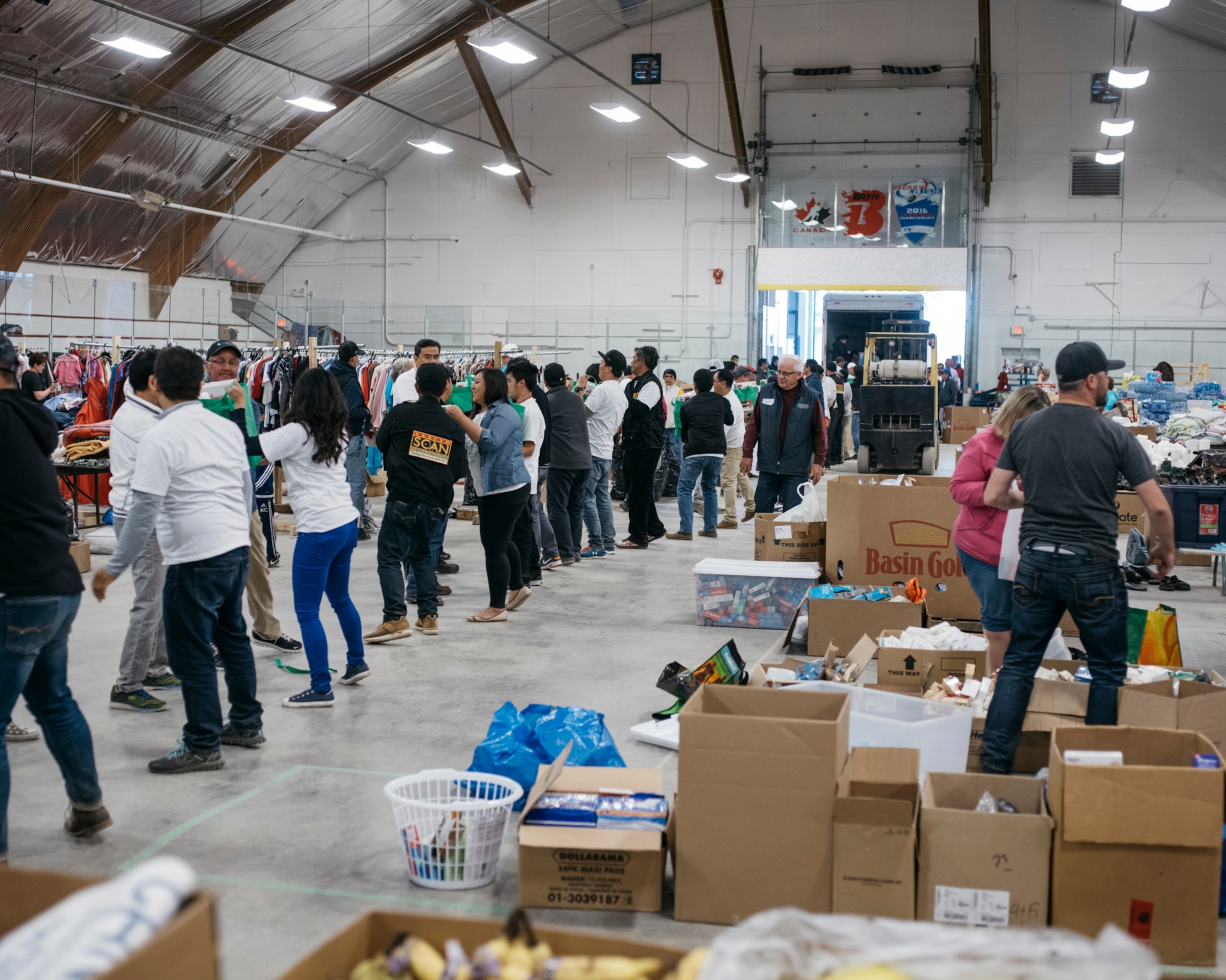 people standing shoulder to shoulder in an arena in Boyle, Alberta, Canada