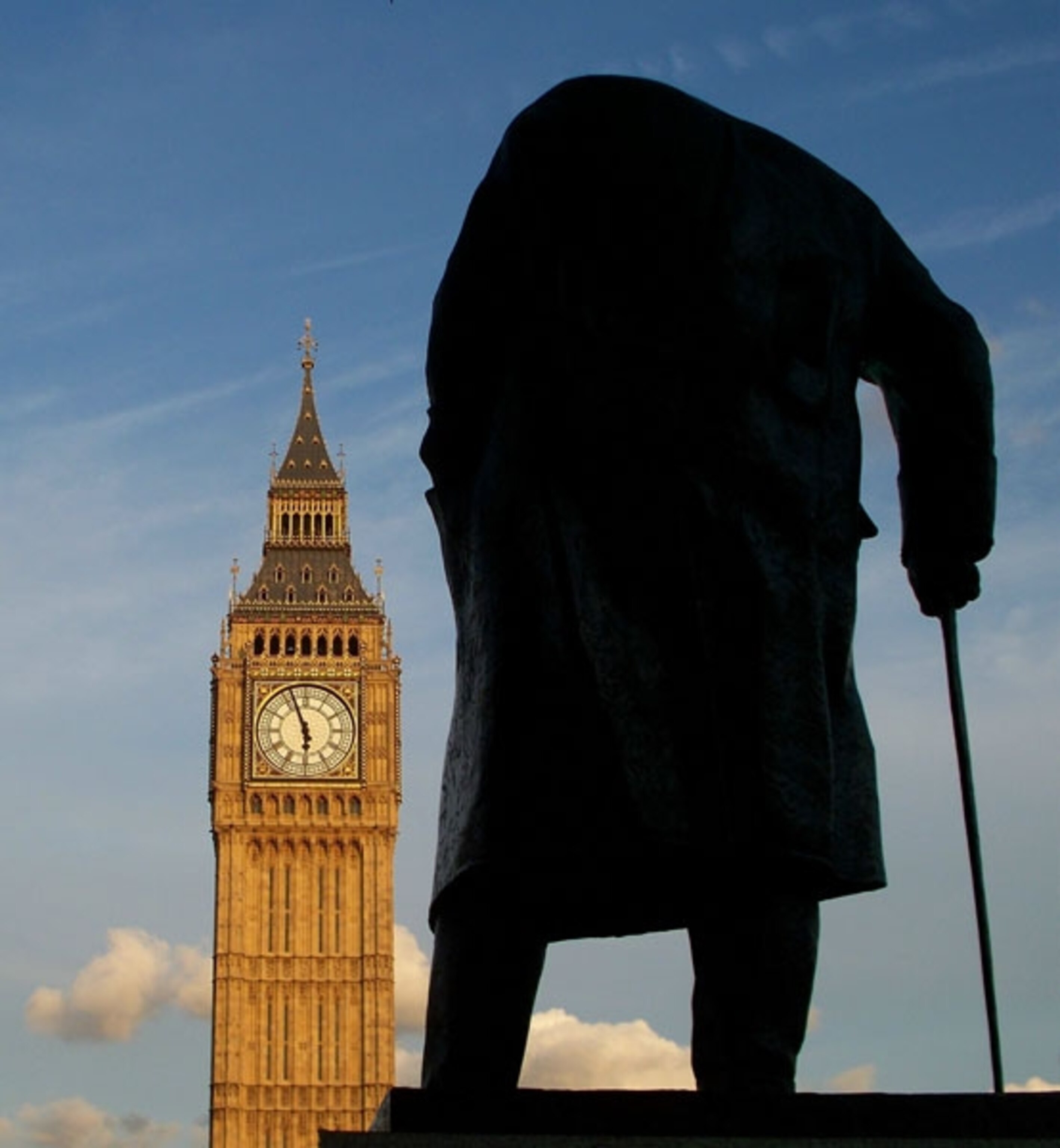 A statue of Winston Churchill in front of Big Ben in London