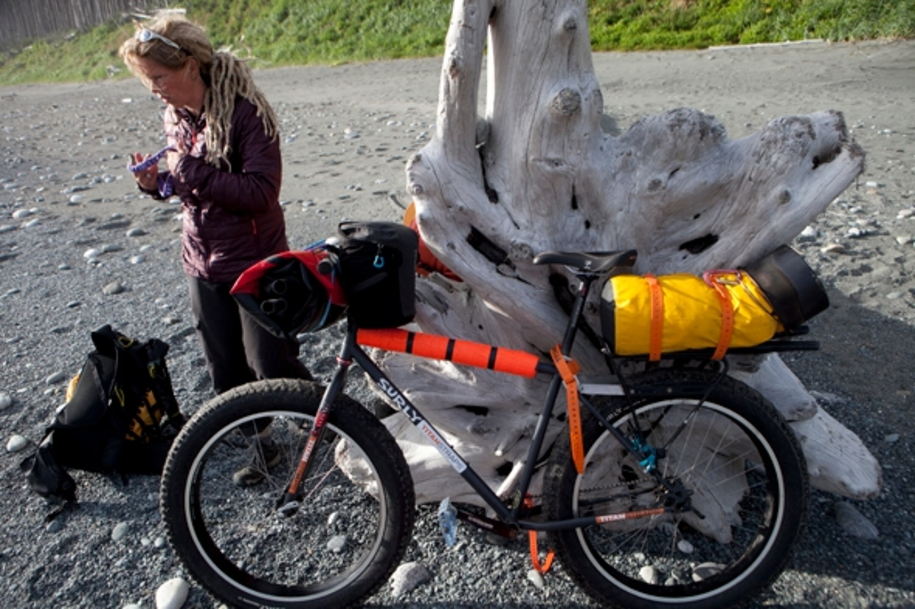 We took a small break to rest and have a snack. On the bluff above us, a curious bear peered through tall grasses and brush; Photograph by Cameron Lawson