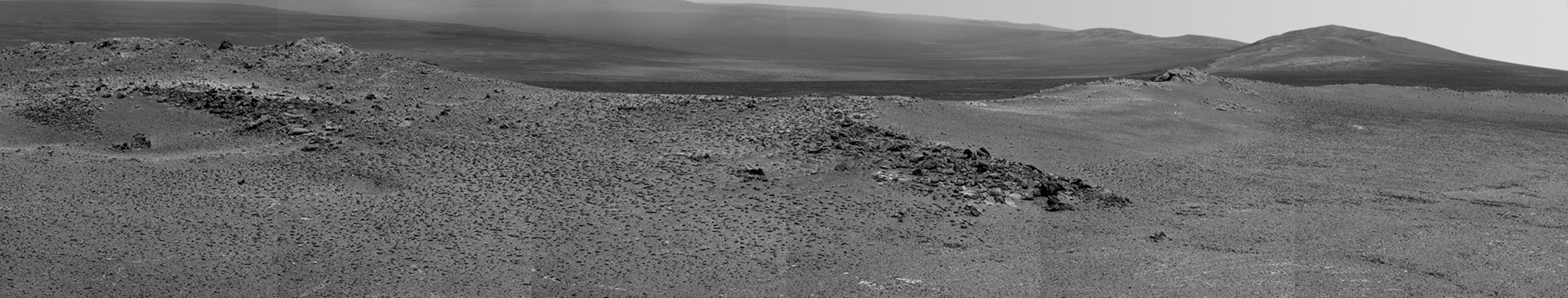 NASA's Mars Exploration Rover Opportunity captured this view of "Burns Cliff" after driving right to the base of this southeastern portion of the inner wall of "Endurance Crater." The view combines frames taken by Opportunity's panoramic camera between the rover's 287th and 294th martian days (Nov. 13 to 20, 2004).