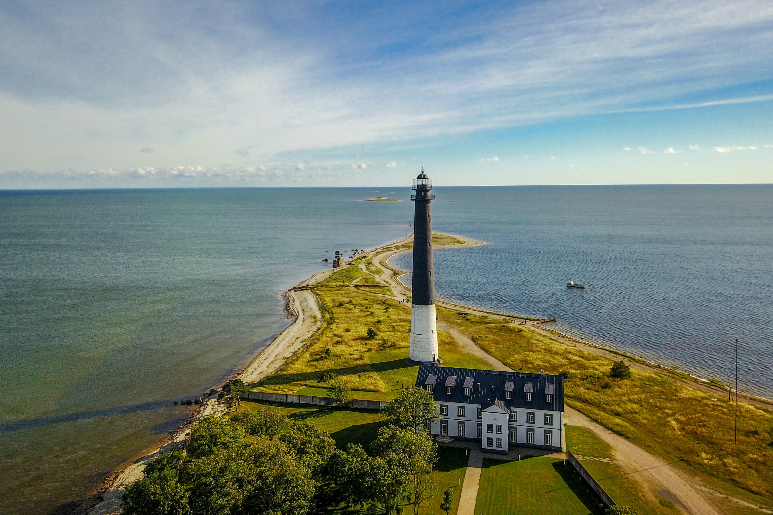 Black and white lighthouse by the coast