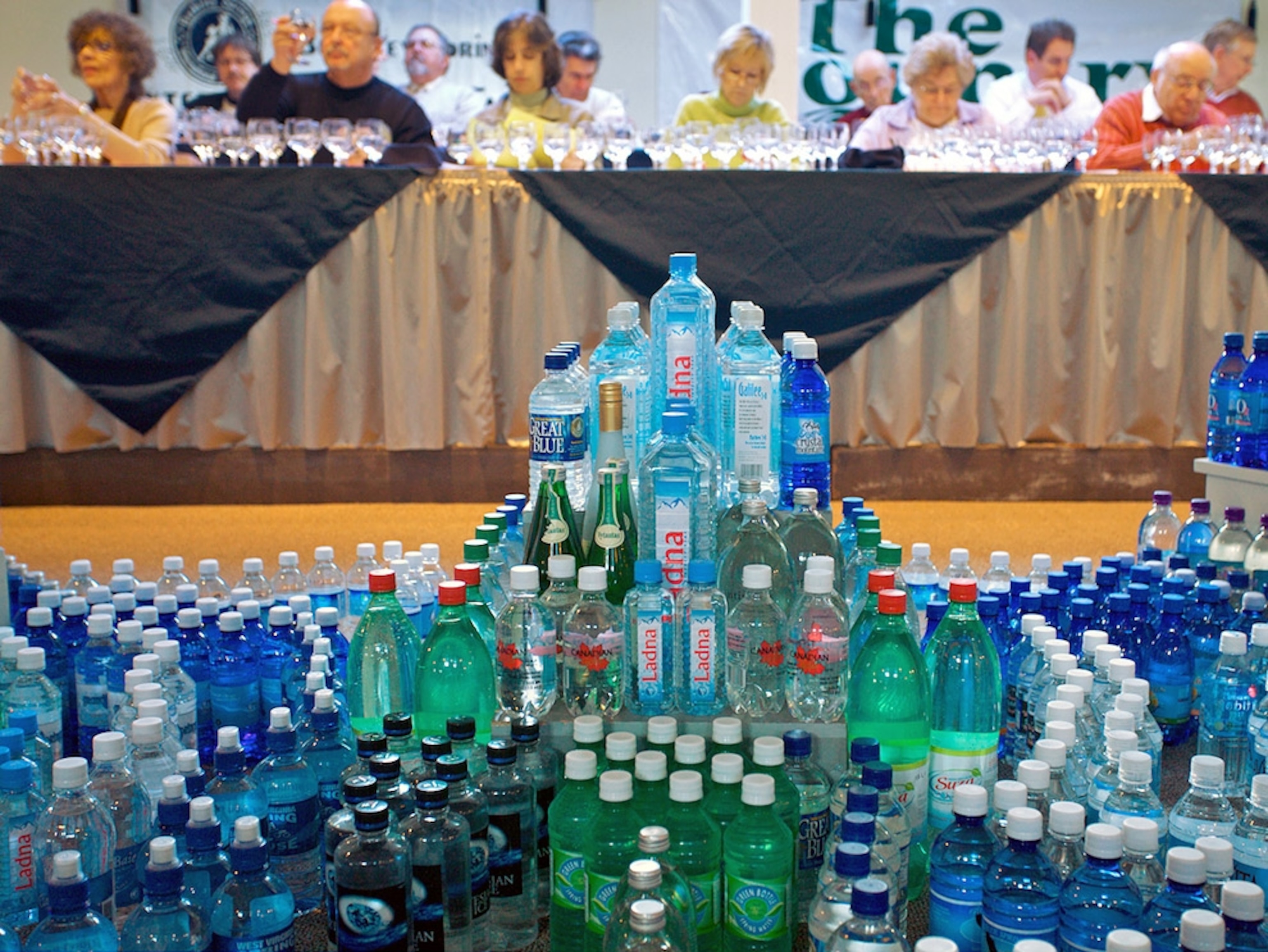 Bottled water stacked in front of a table