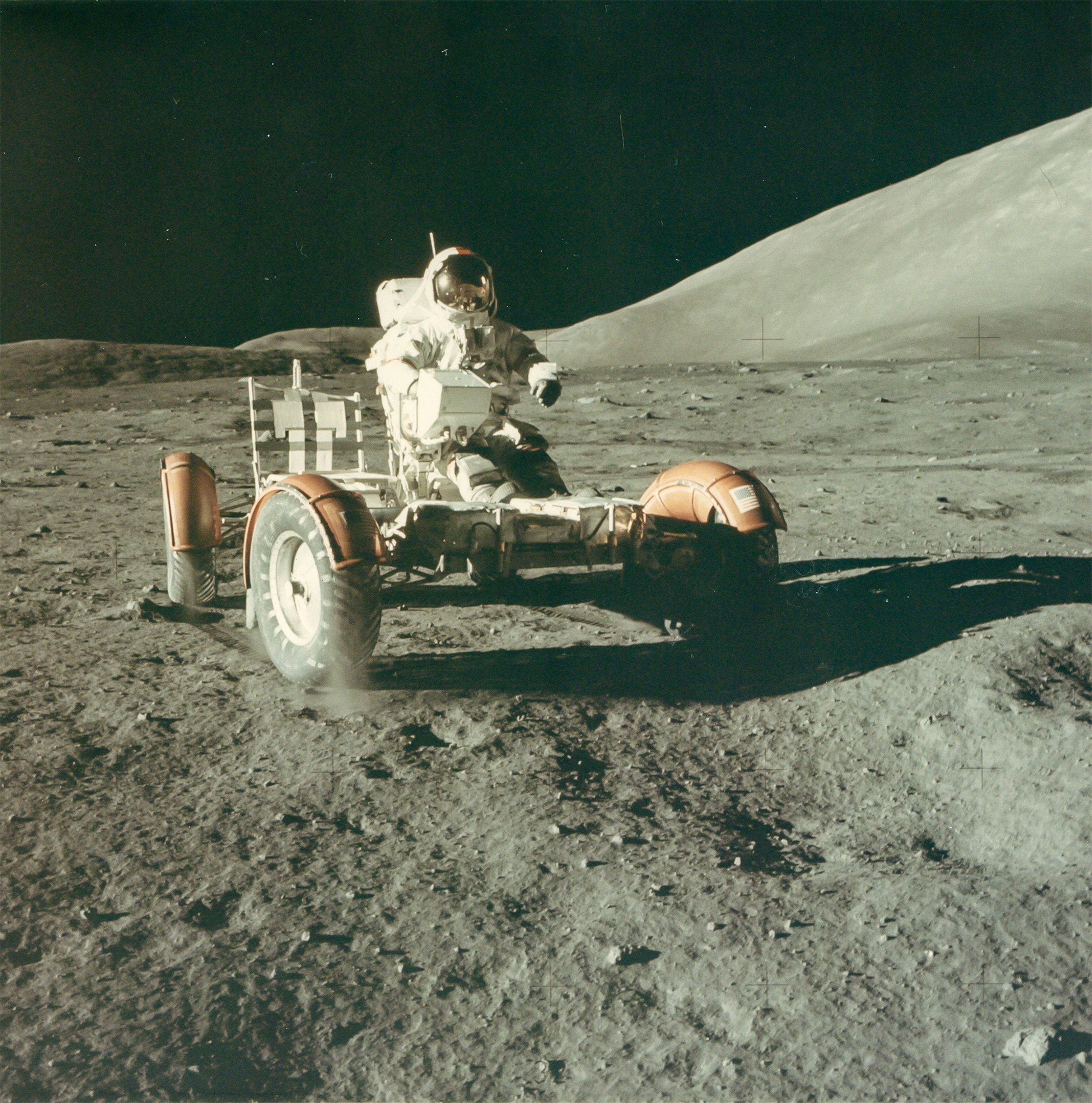 astronaut Eugene Cernan testing the lunar rover on the moon in 1972