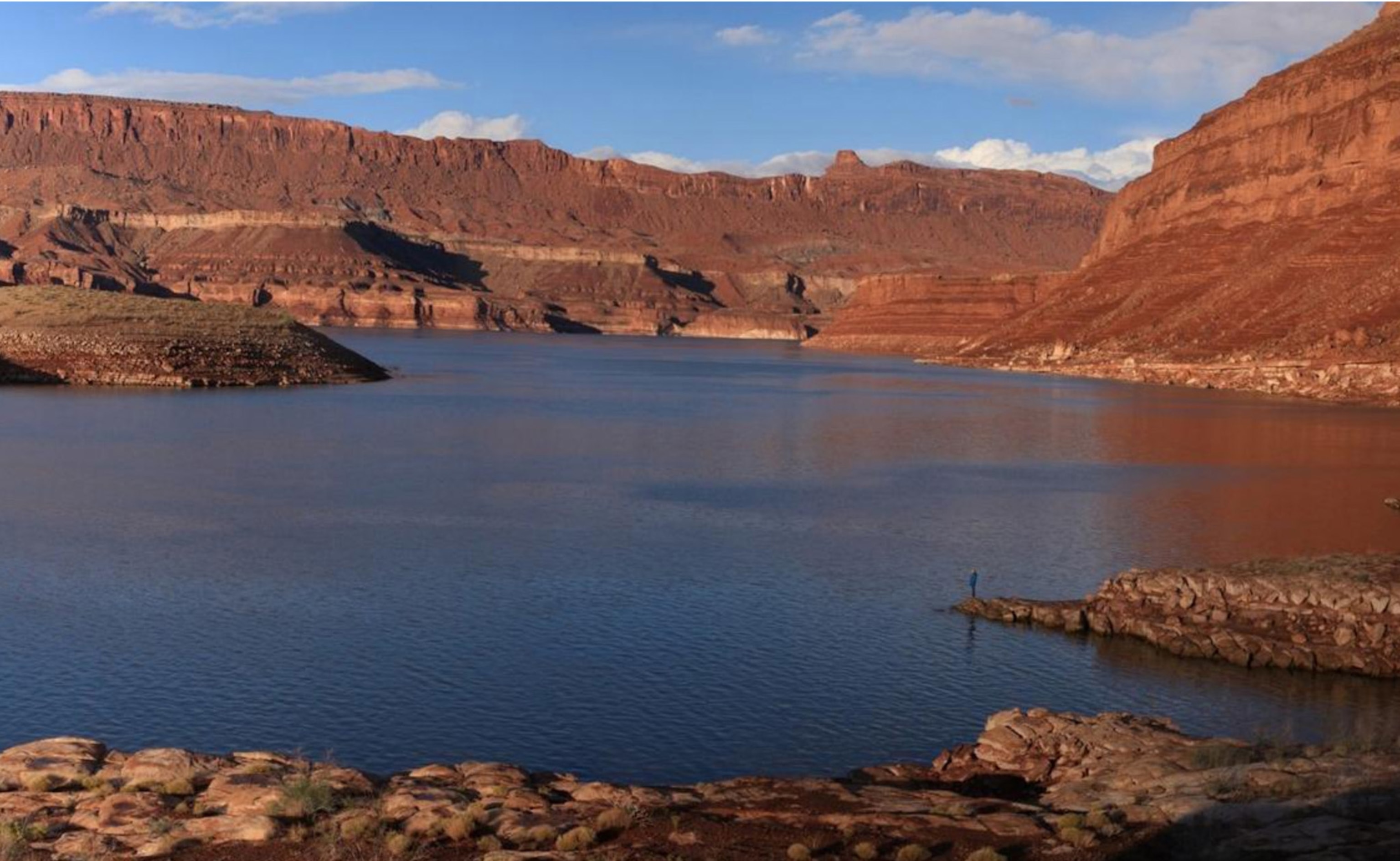 A boat traces the curves of Reflection Canyon, part of Glen Canyon.