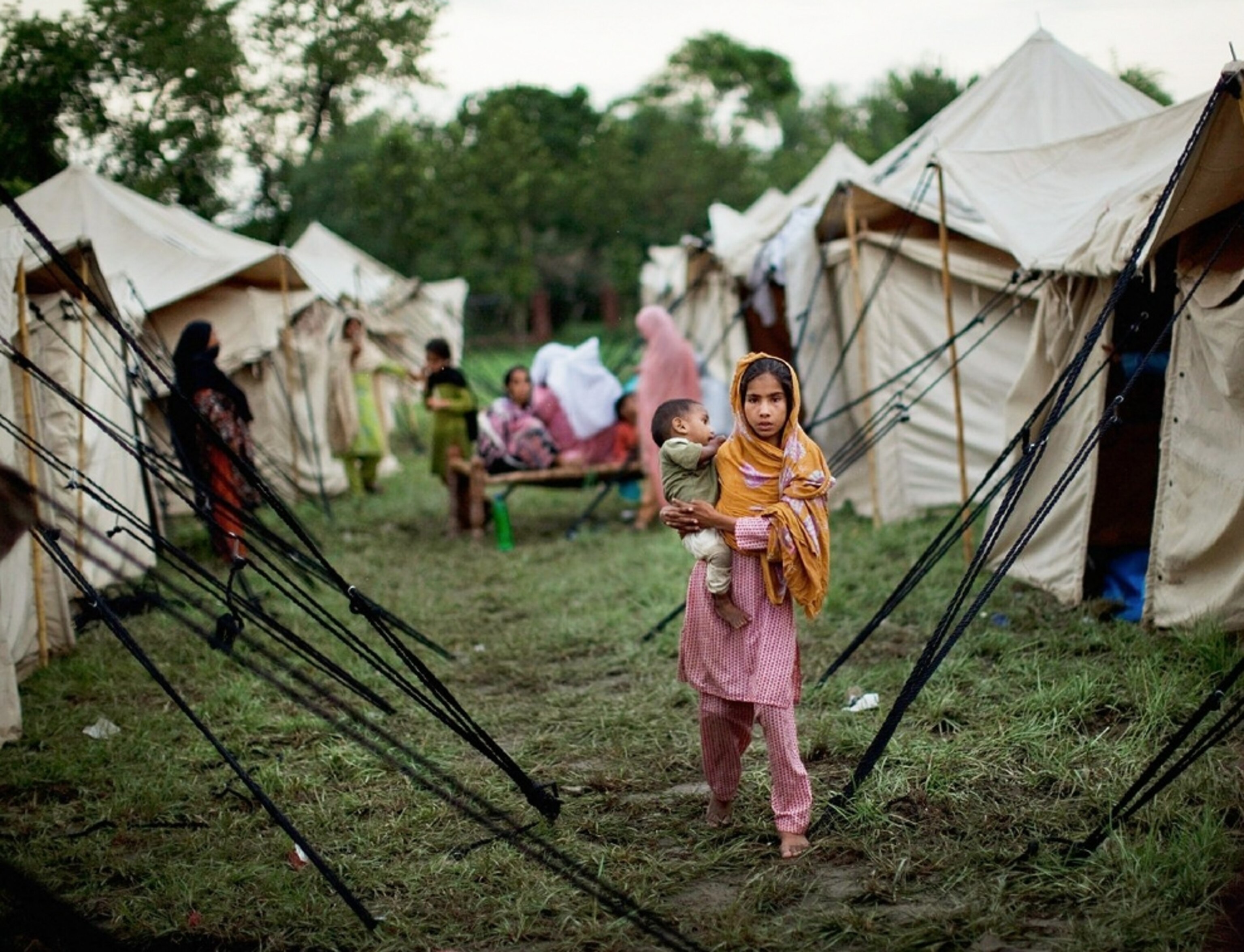 families waiting for help at a relief camp during Pakistan's floods