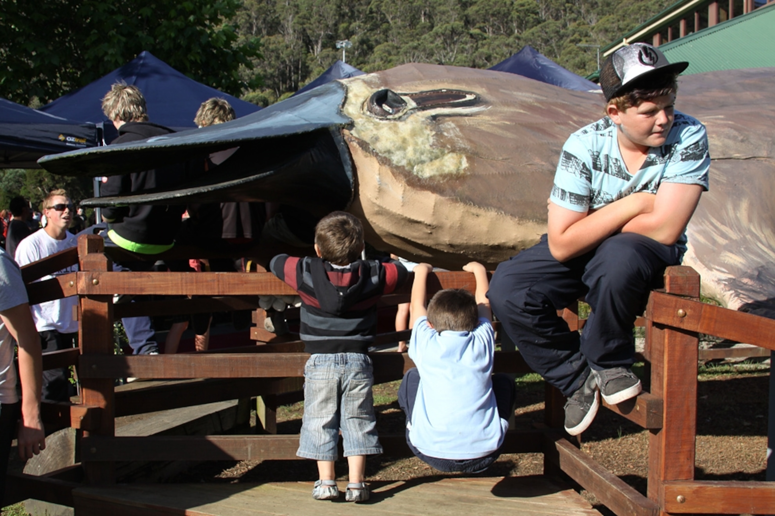 People gather around a mysterious object.