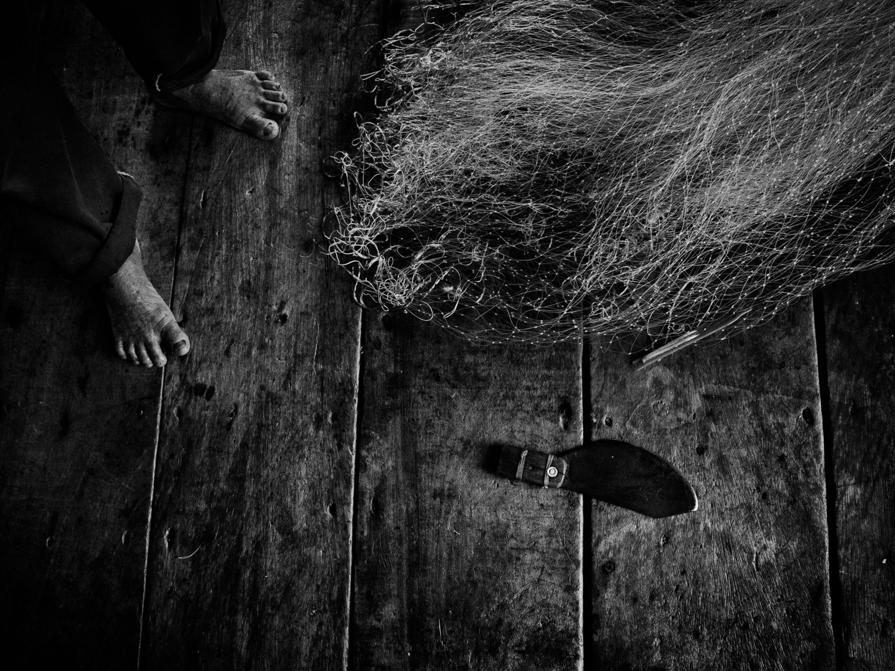 a fisherman's net and knife