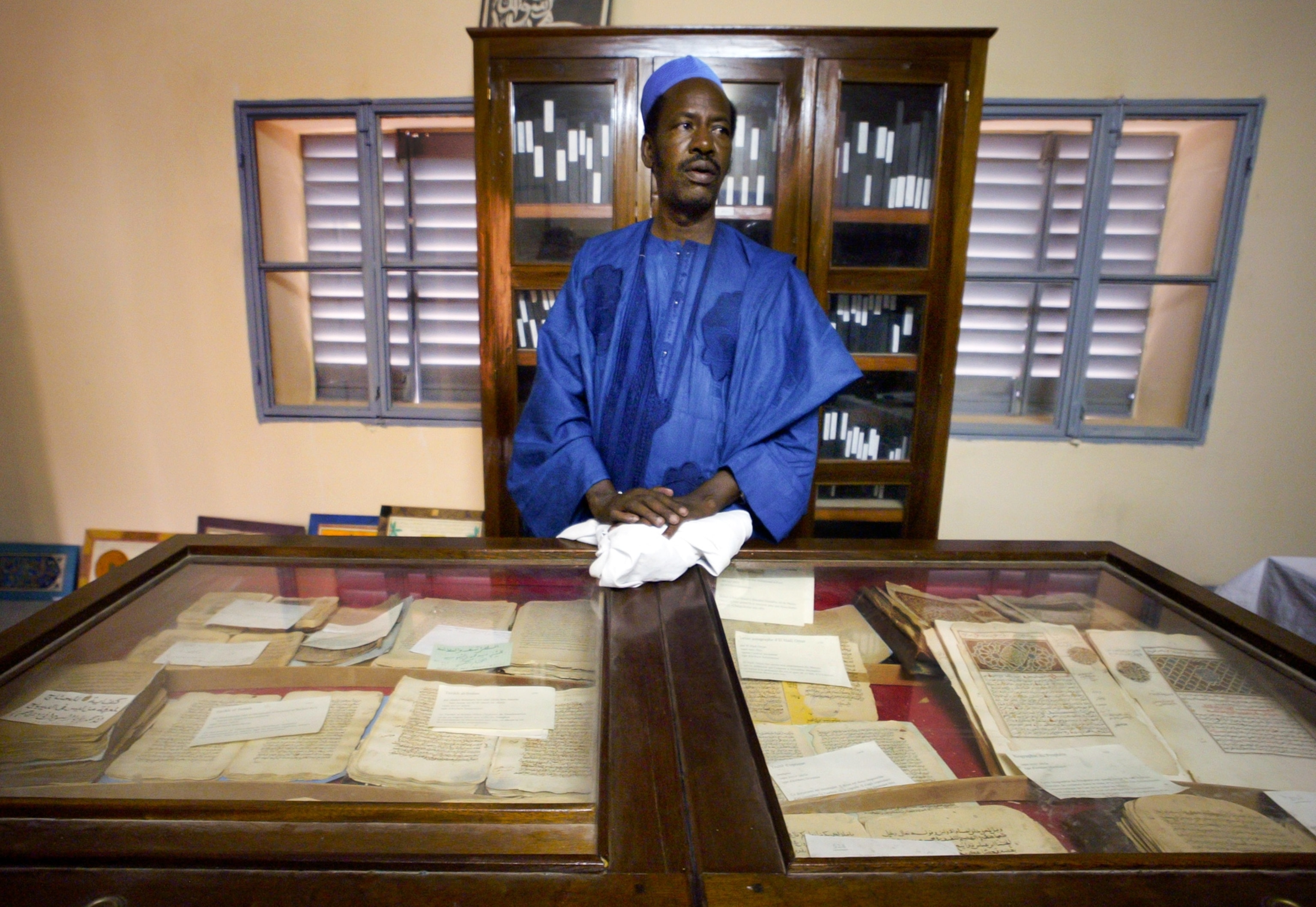 A librarian and manuscripts in the Ahmed Baba Institute in Timbuktu, Mali.