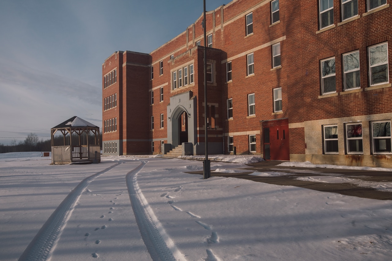 Photo of red brick building which was a residential school