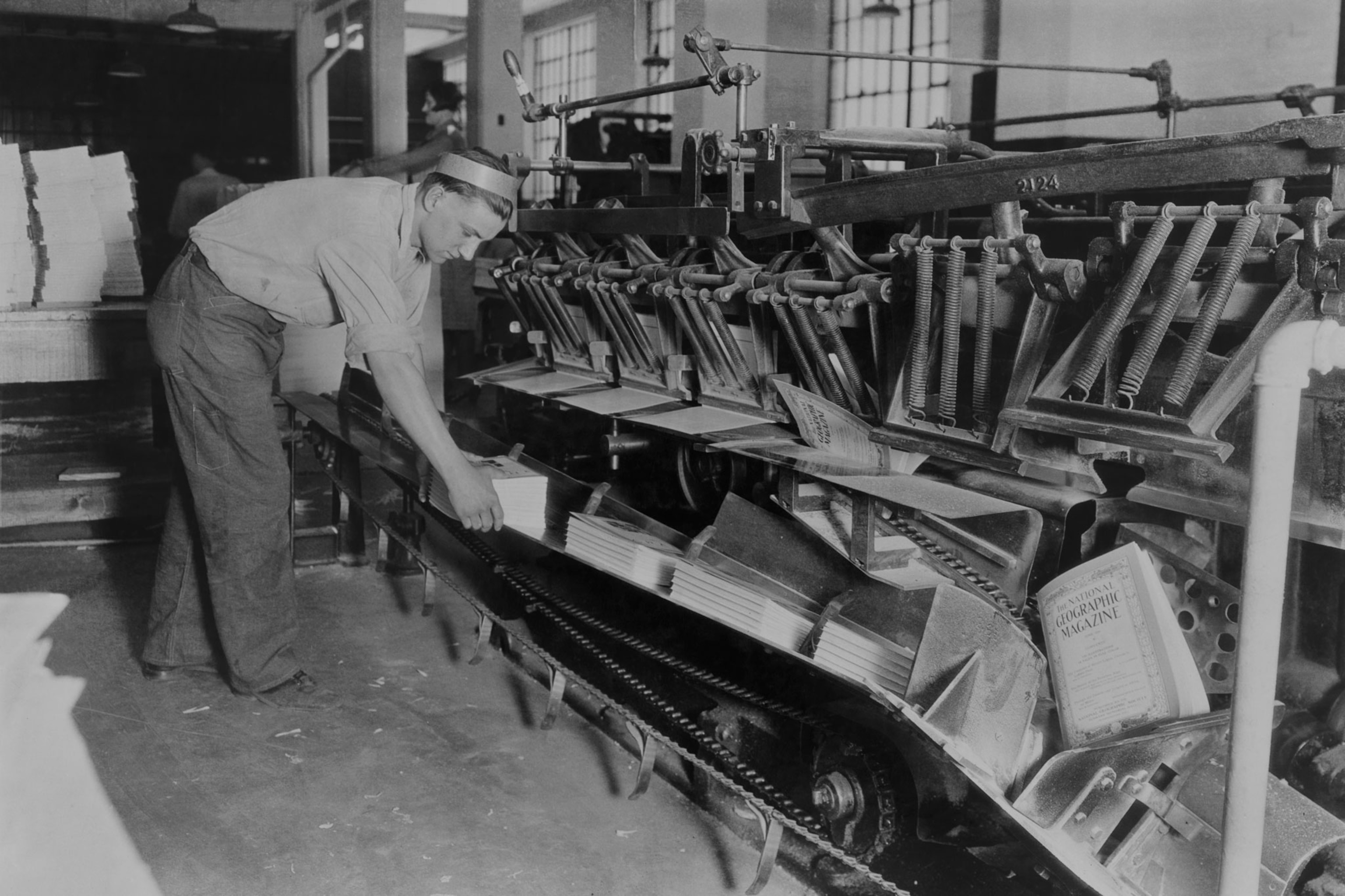 a man working at a printing machine