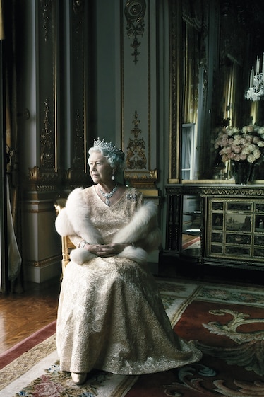 Queen Elizabeth sits in Buckingham Palace