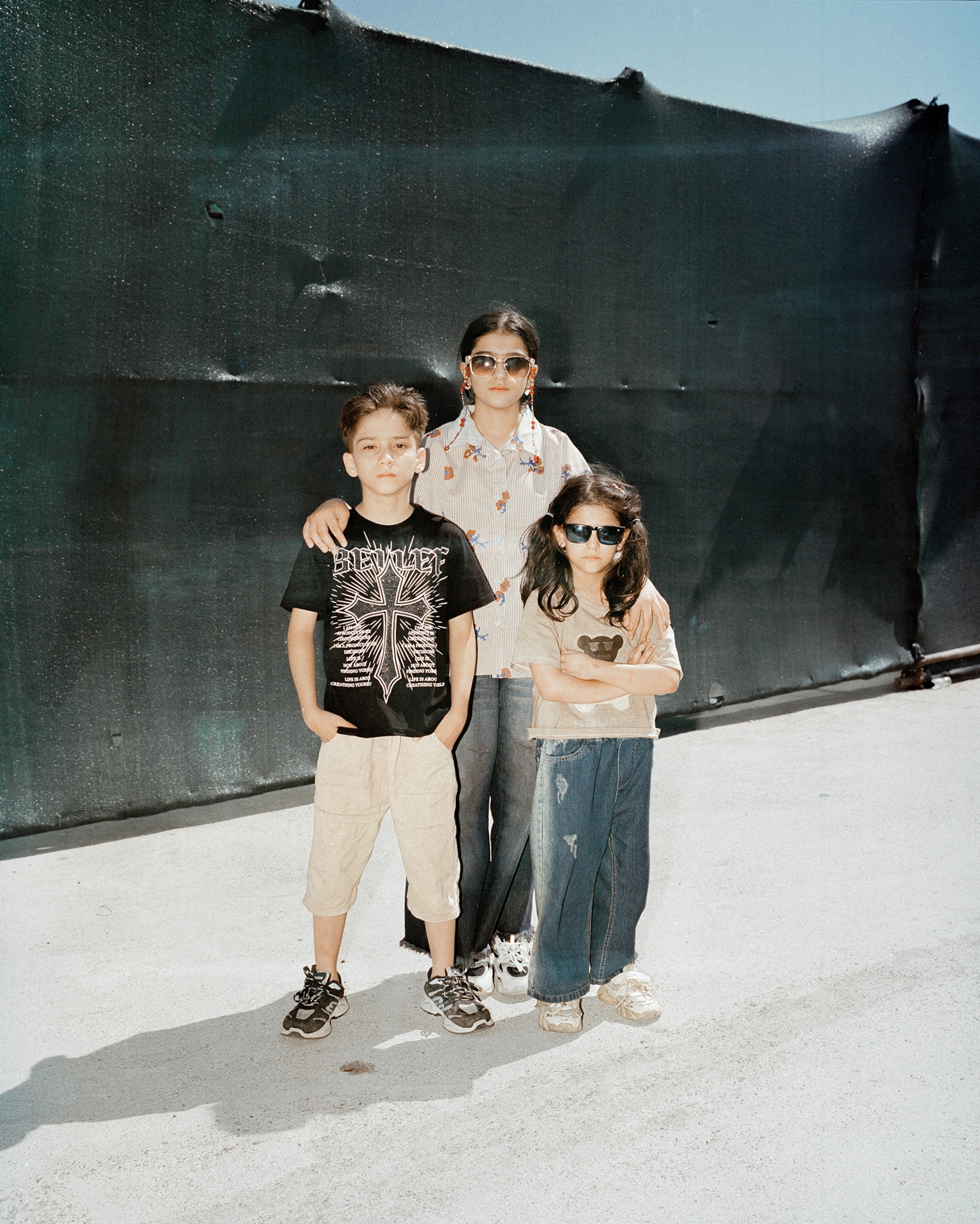 Twelve-year-old Yasmin (center) and her siblings, 11-year-old Yasin (left) and 7-year-old Atena (right), have never known a home other than Iran, where they grew up, went to school, made friends, and experienced a sense of community. Their family held legal documents to allow them to live and work in Iran. But that meant little when the Iranian government decided that they would be deported. Overnight, their realities shifted as they were ordered to leave and return to a country where they have no relatives, home or community, or support system to help them build a life. It is particularly harder for the women and young girls, who will for the first time in their lives experience life under the Taliban with mounting restrictions and attacks on their freedoms.