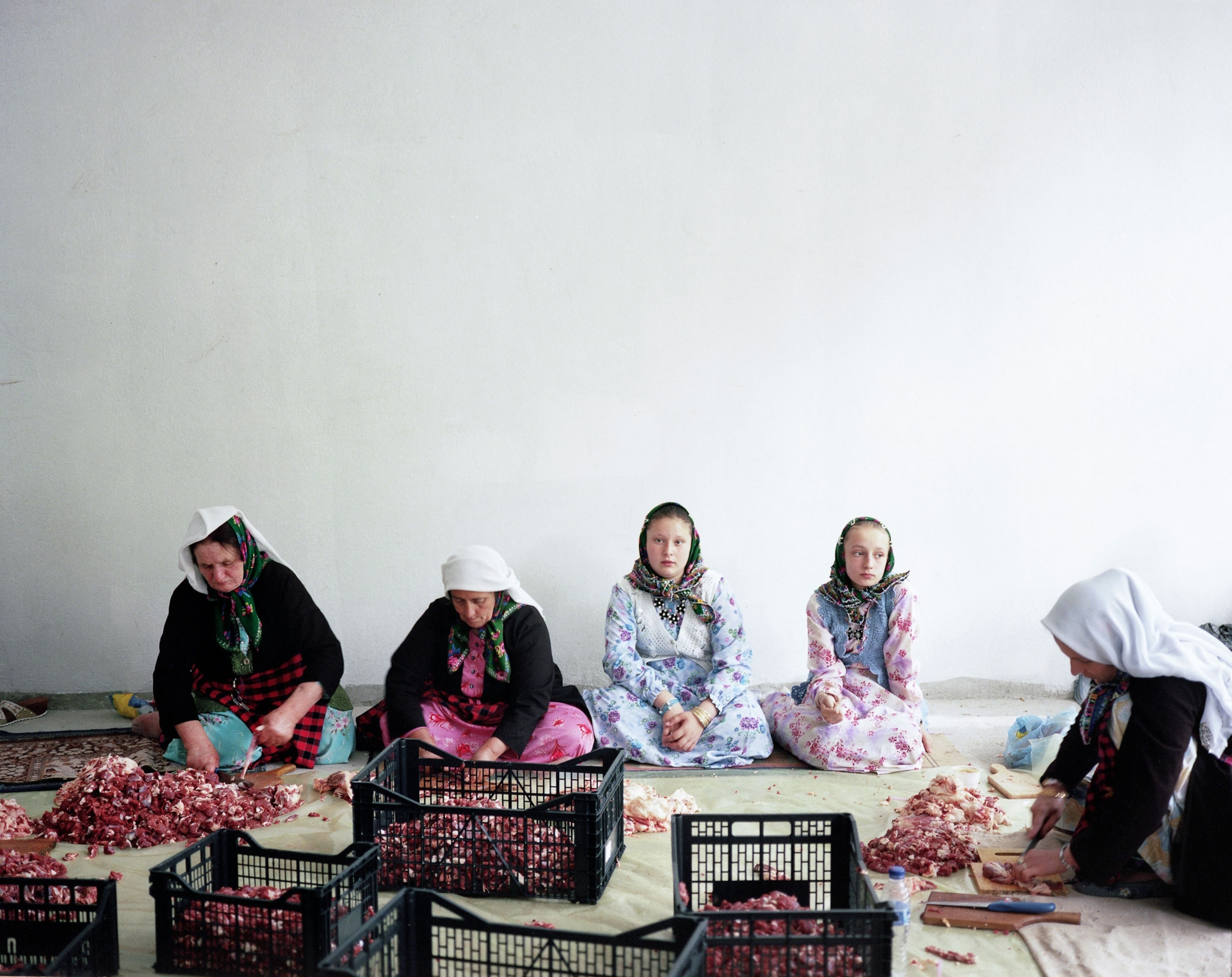 a Pomak women butchering meat in Greece