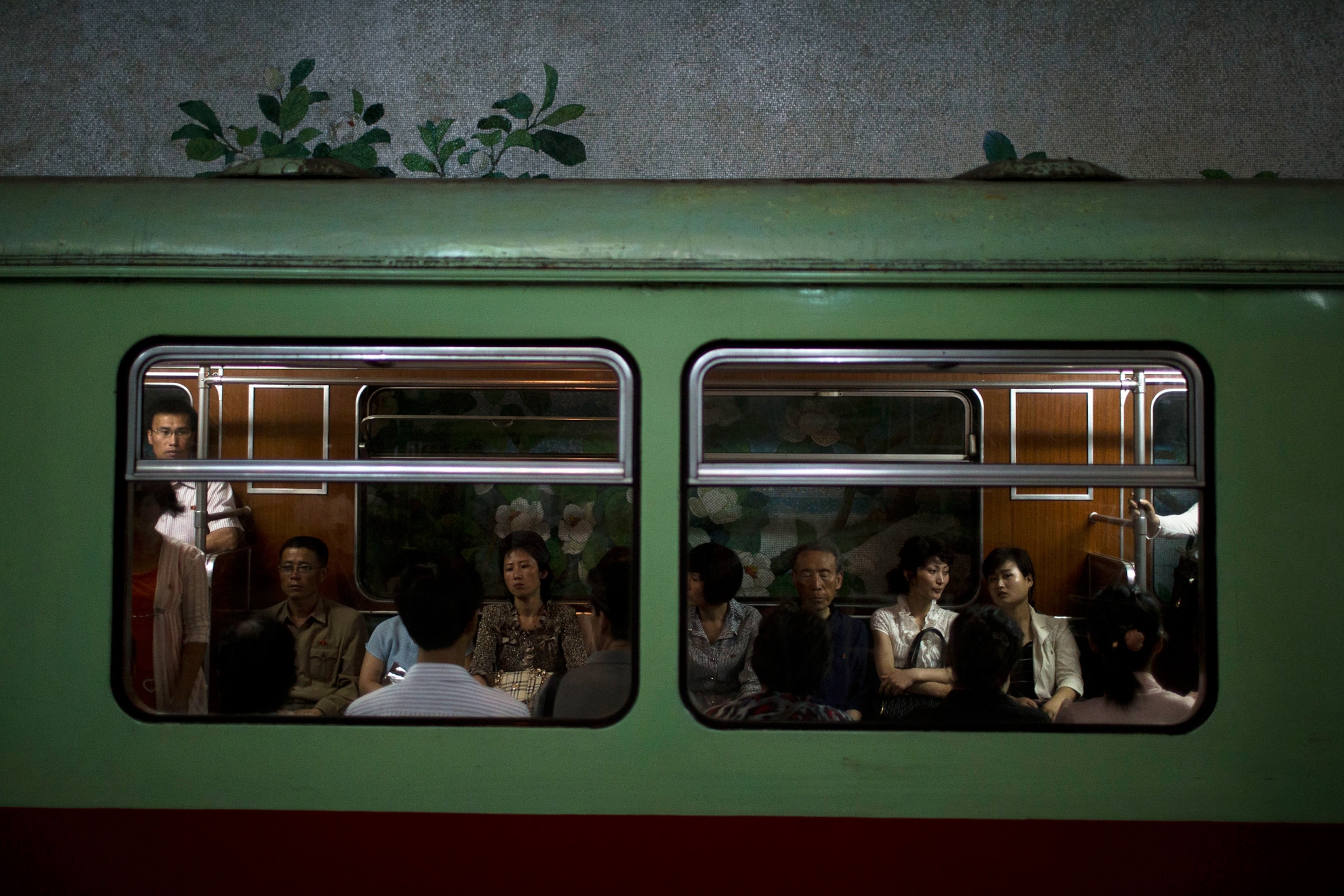 commuters on a subway train in North Korea