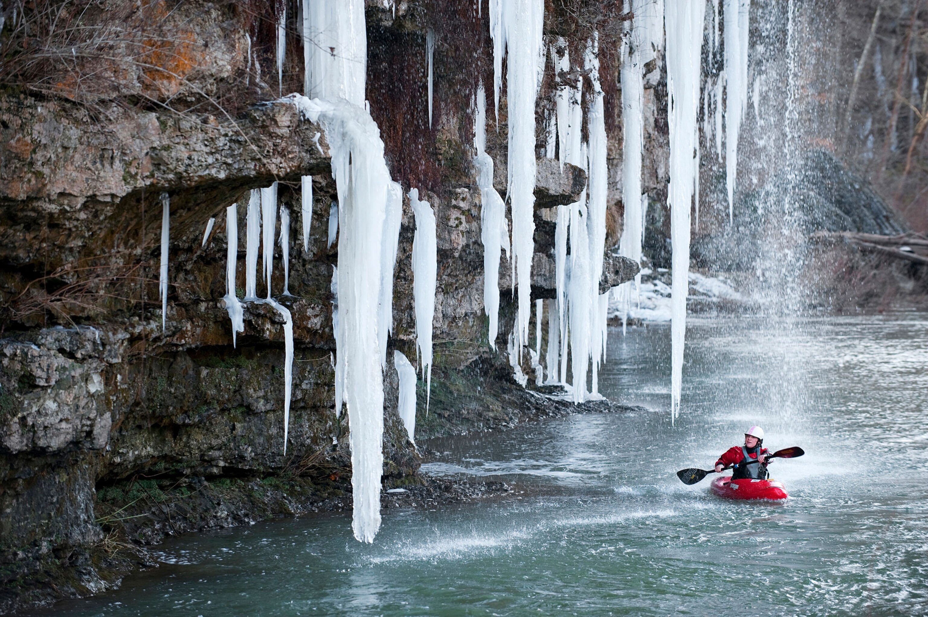 a kayaker kayaking on the Caney Fork in Rock Island, Tennessee
