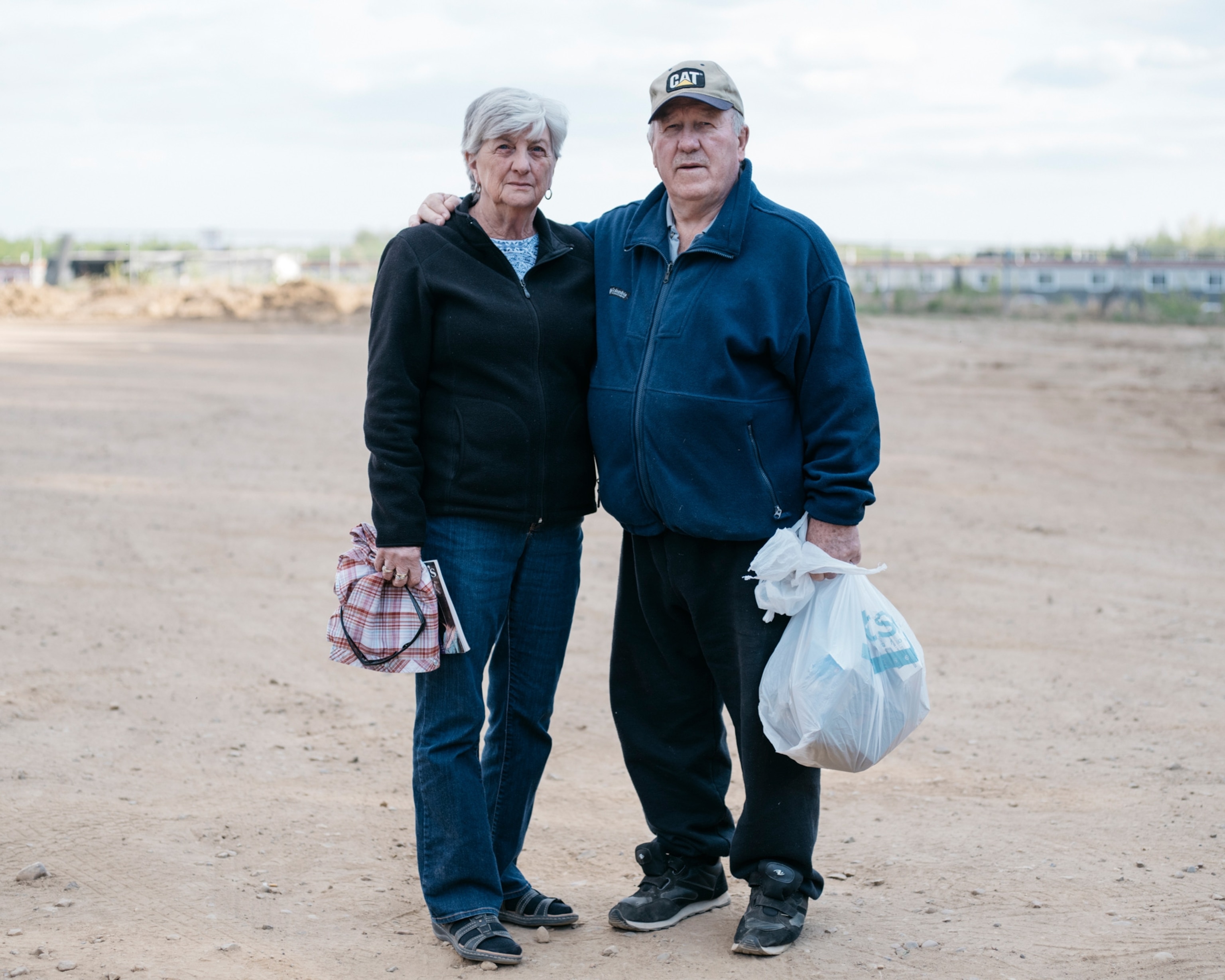 woman and man holding plastic bag