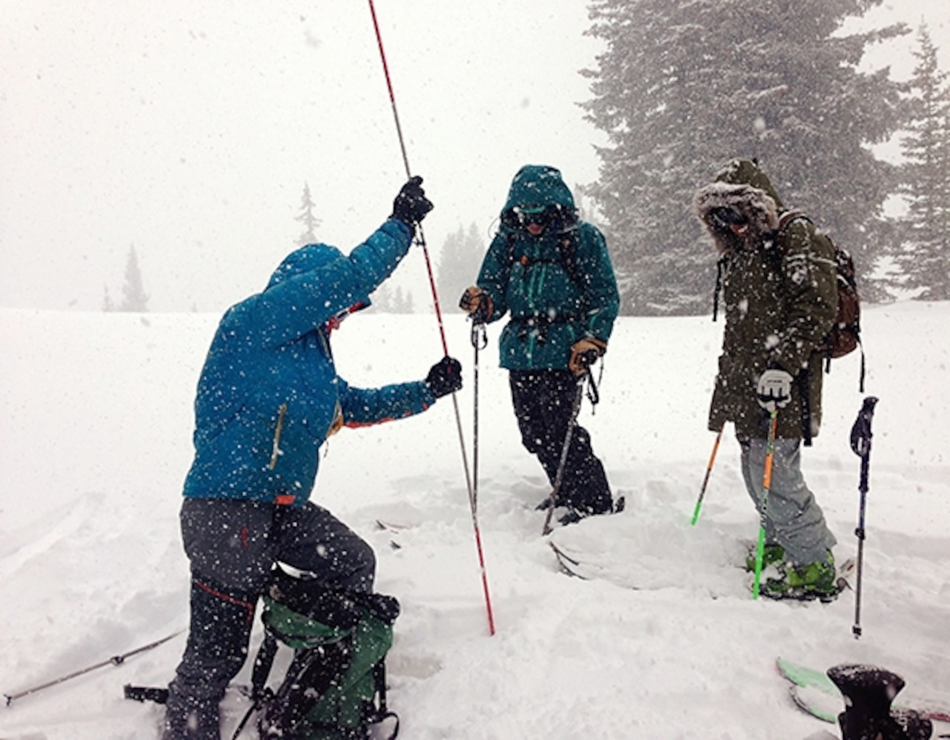 Instructor Britt Ruegger of Aspen Expeditions demonstrates avalanche probing and rescue in an AIARE Avalanche Level 1 course of the back of Aspen Mountain; Photograph by Cat Jaffee
