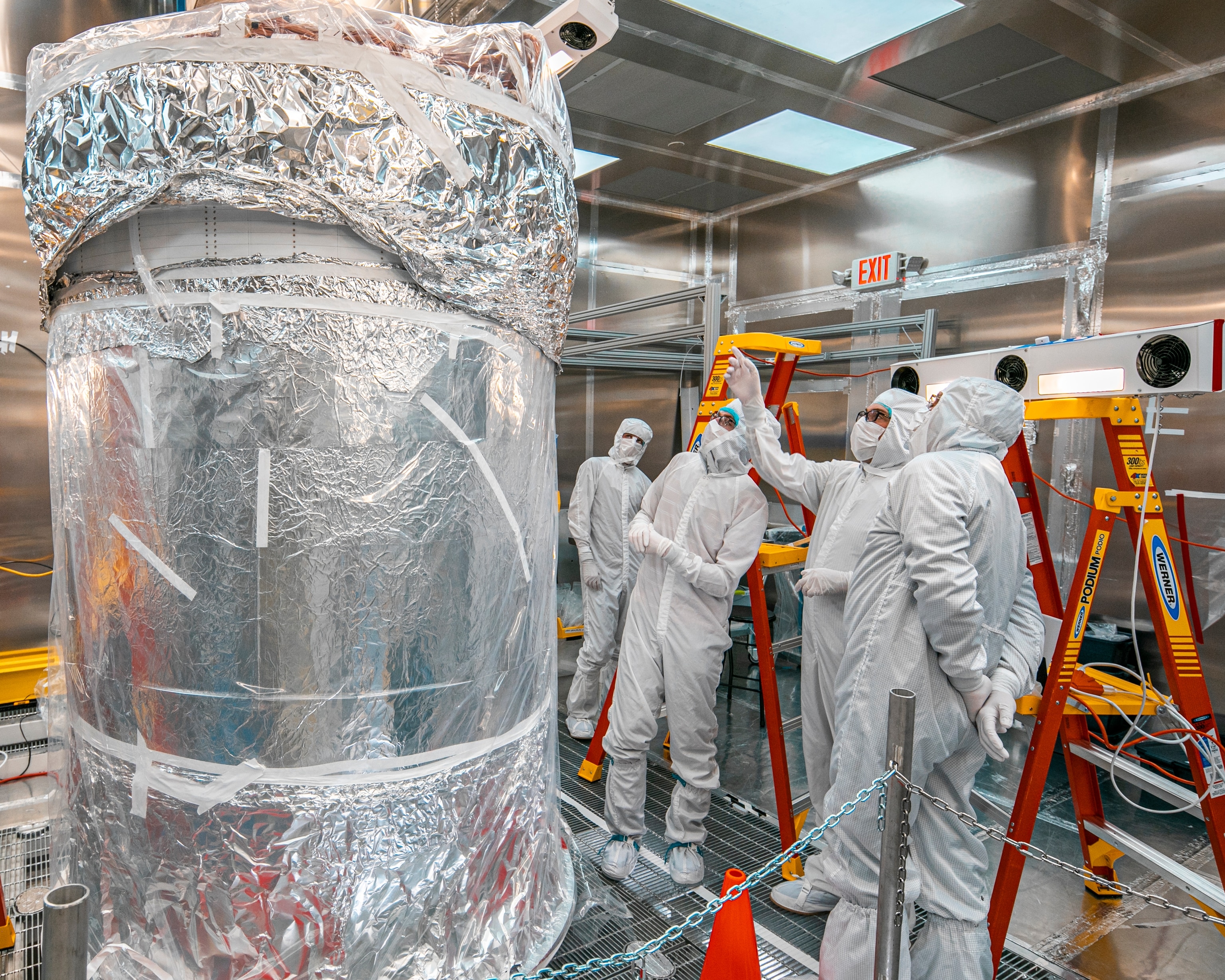 Members of the LZ team in the LZ water tank after the outer detector installation.