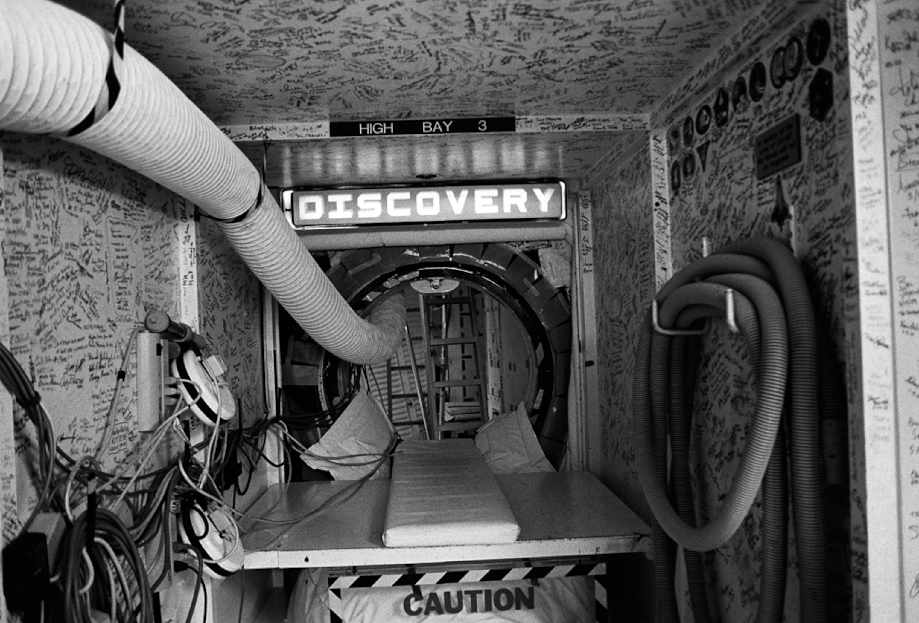 a clean room opened to the space shuttle Discovery