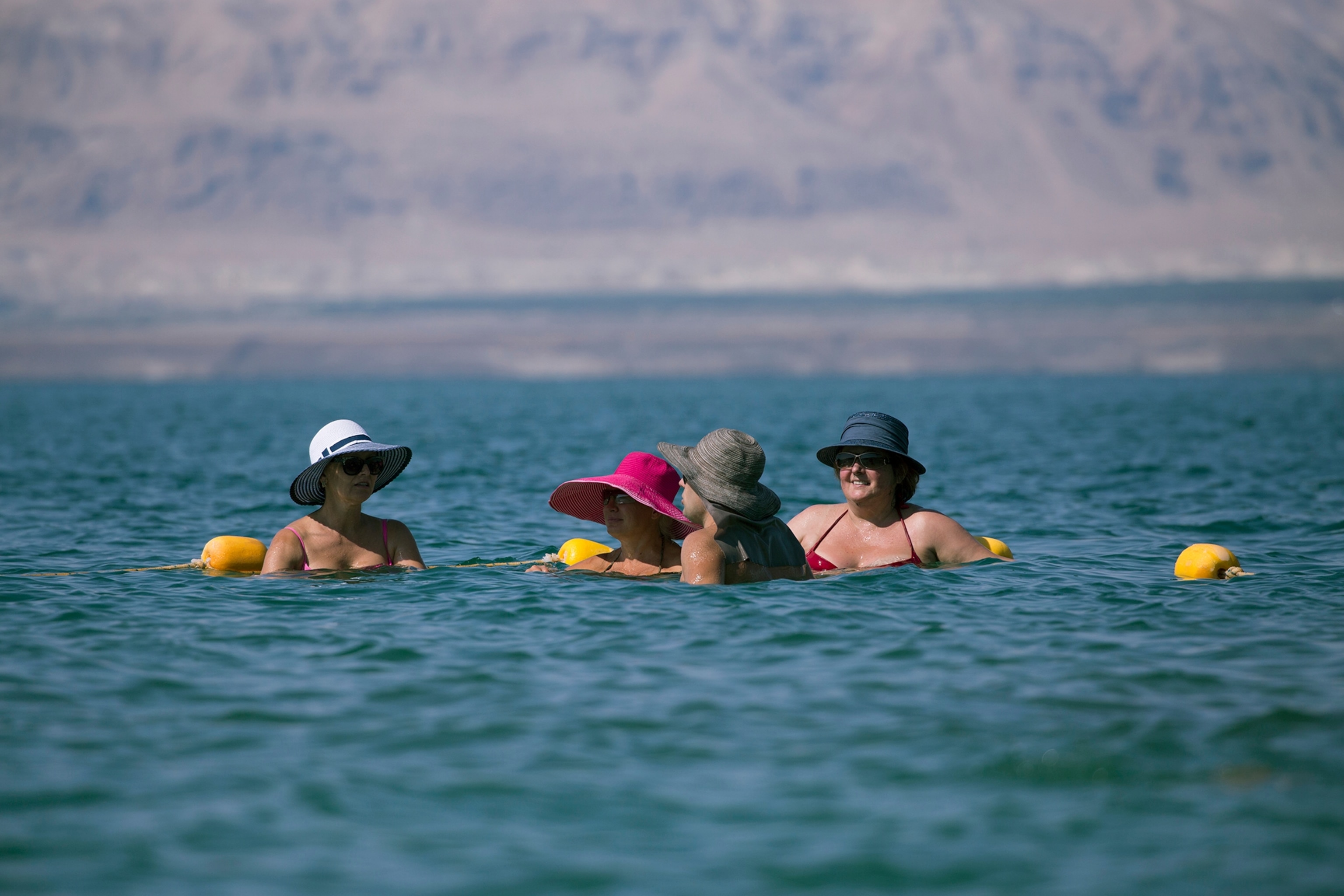 women in the Dead Sea of Jordan