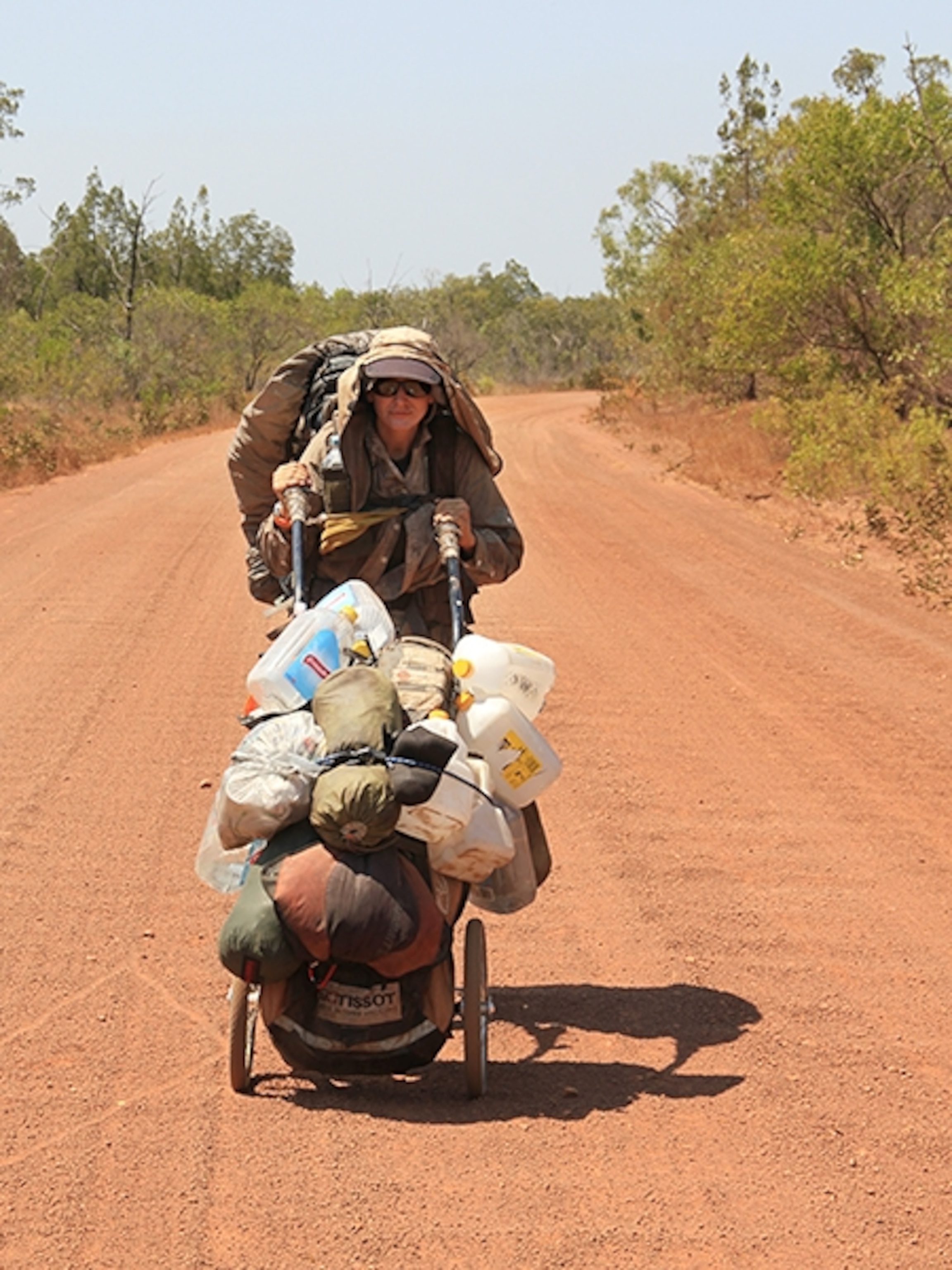 Sarah Marquis pushing a water cart, Australia
