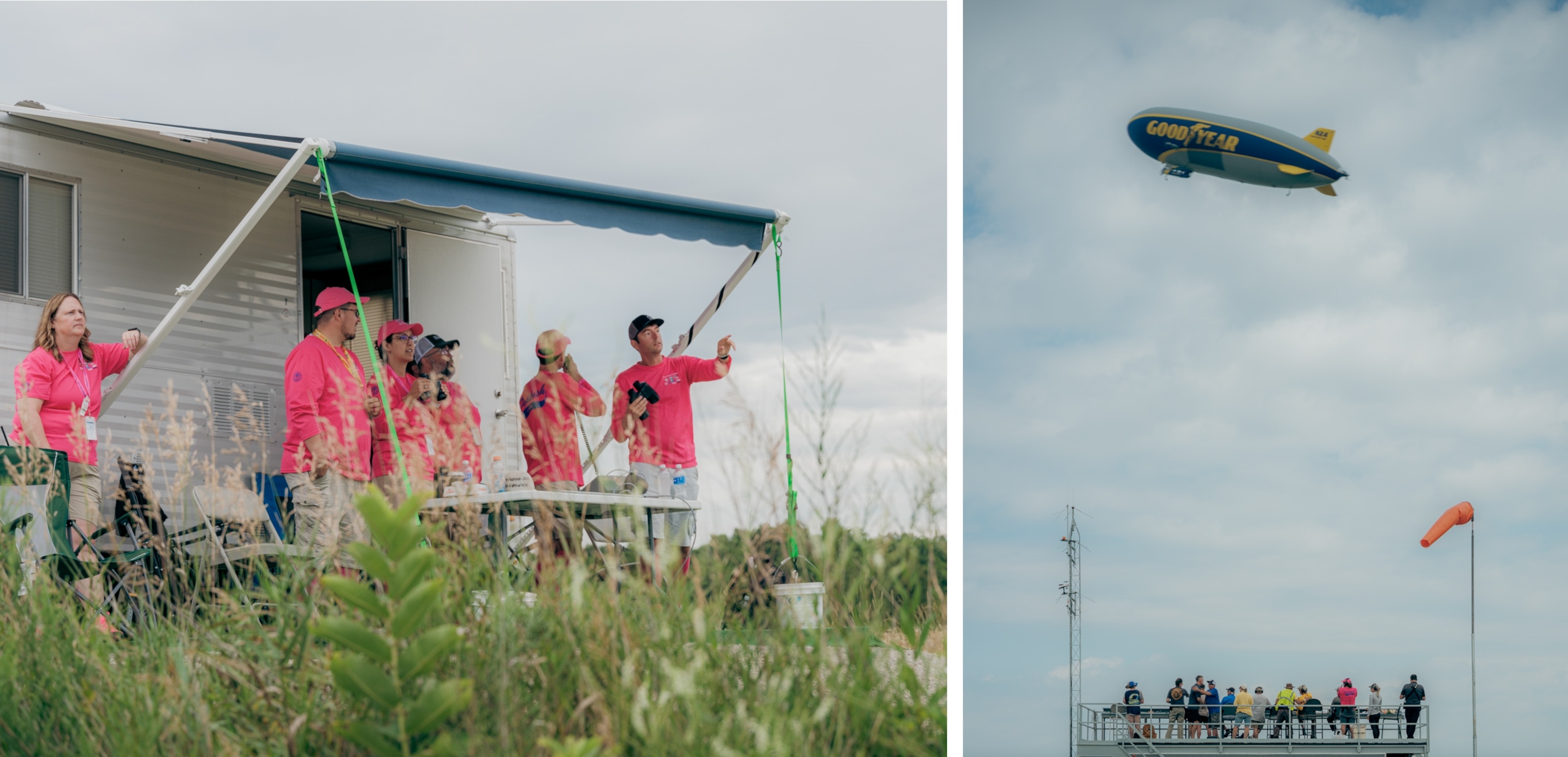 On the left, a group of people in pink shirts stand under an awning beside a trailer, looking and pointing toward the sky in a grassy outdoor setting. On the right, a Goodyear blimp floats in a cloudy sky above a viewing platform with people watching below.