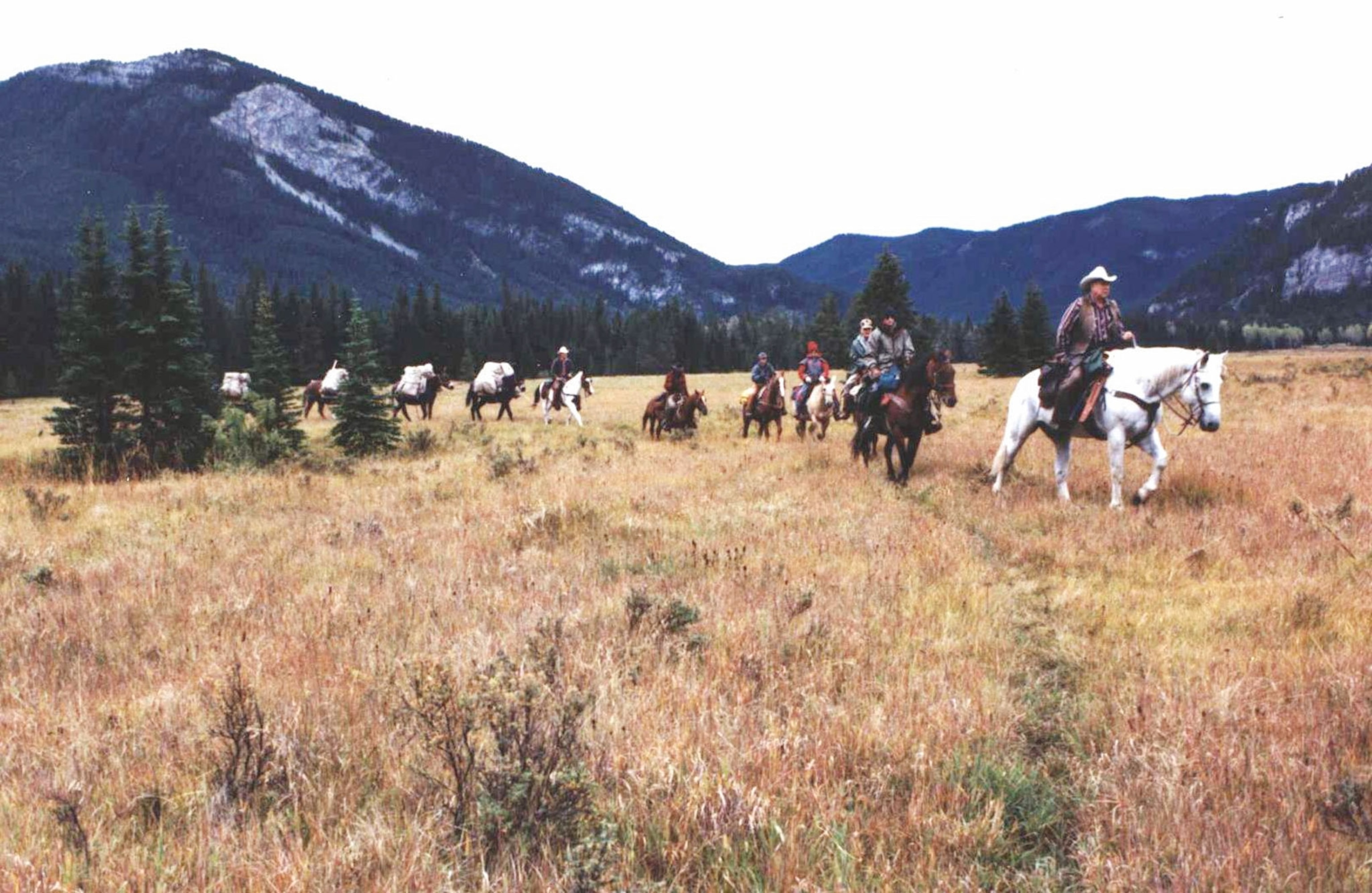 Smoke Elser leading a group on horses