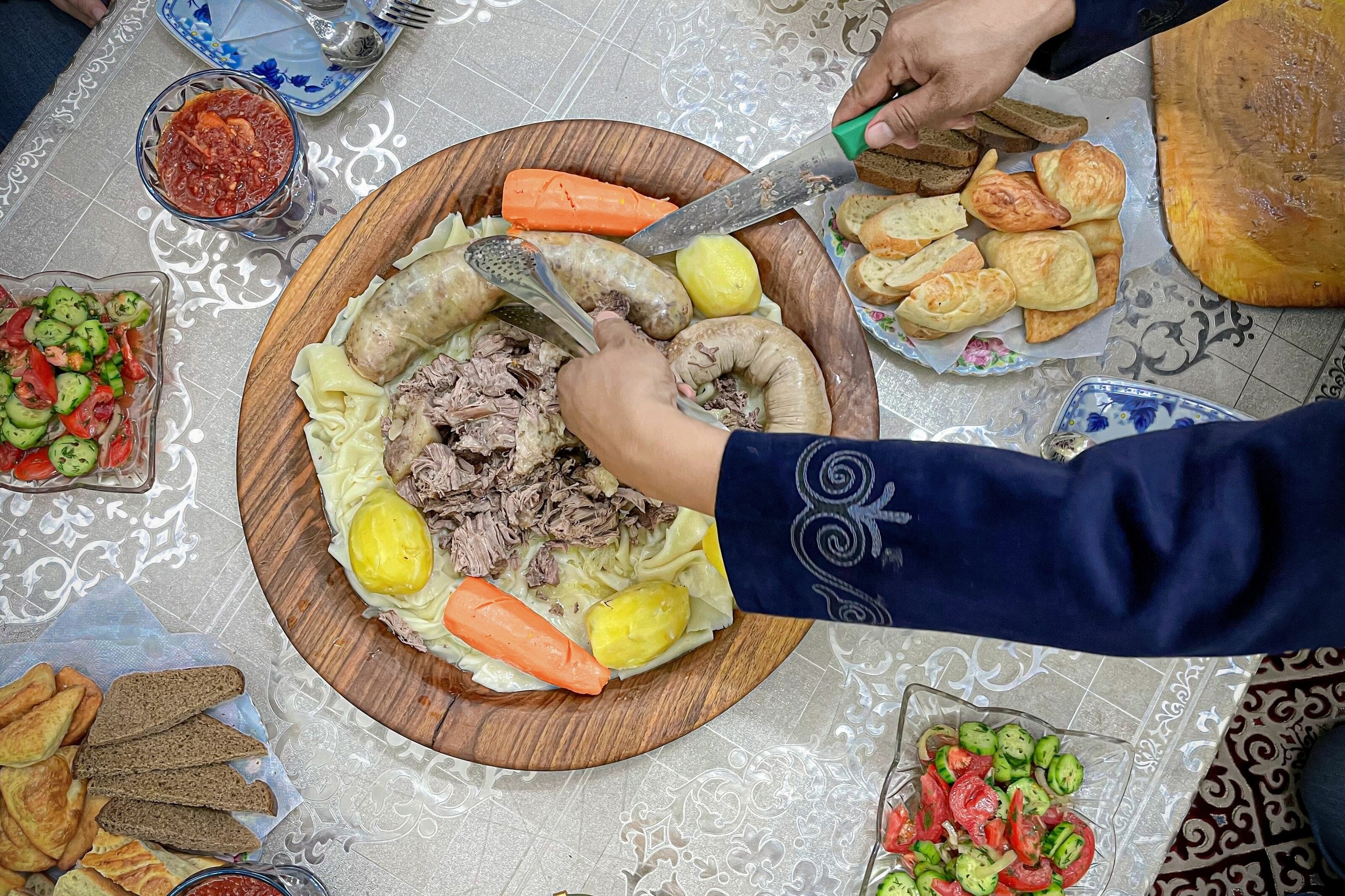 A sharing plate of lasagne sheet-sized noodles topped with slow-cooked lamb, kazy (horse-meat sausage) and chyk (onion broth).
