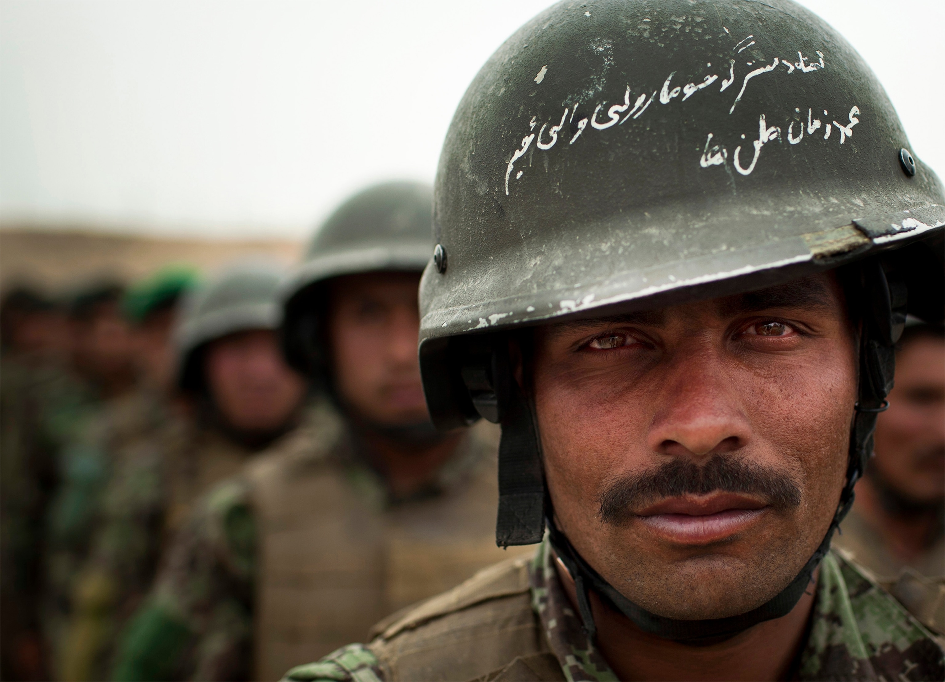 an Afghan National Police officer manning a checkpoint.