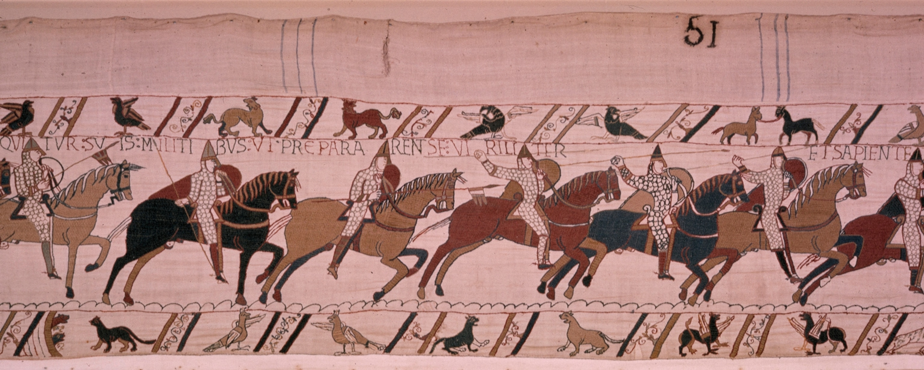 A battle scene in the tapestry in which William I encourages his men.