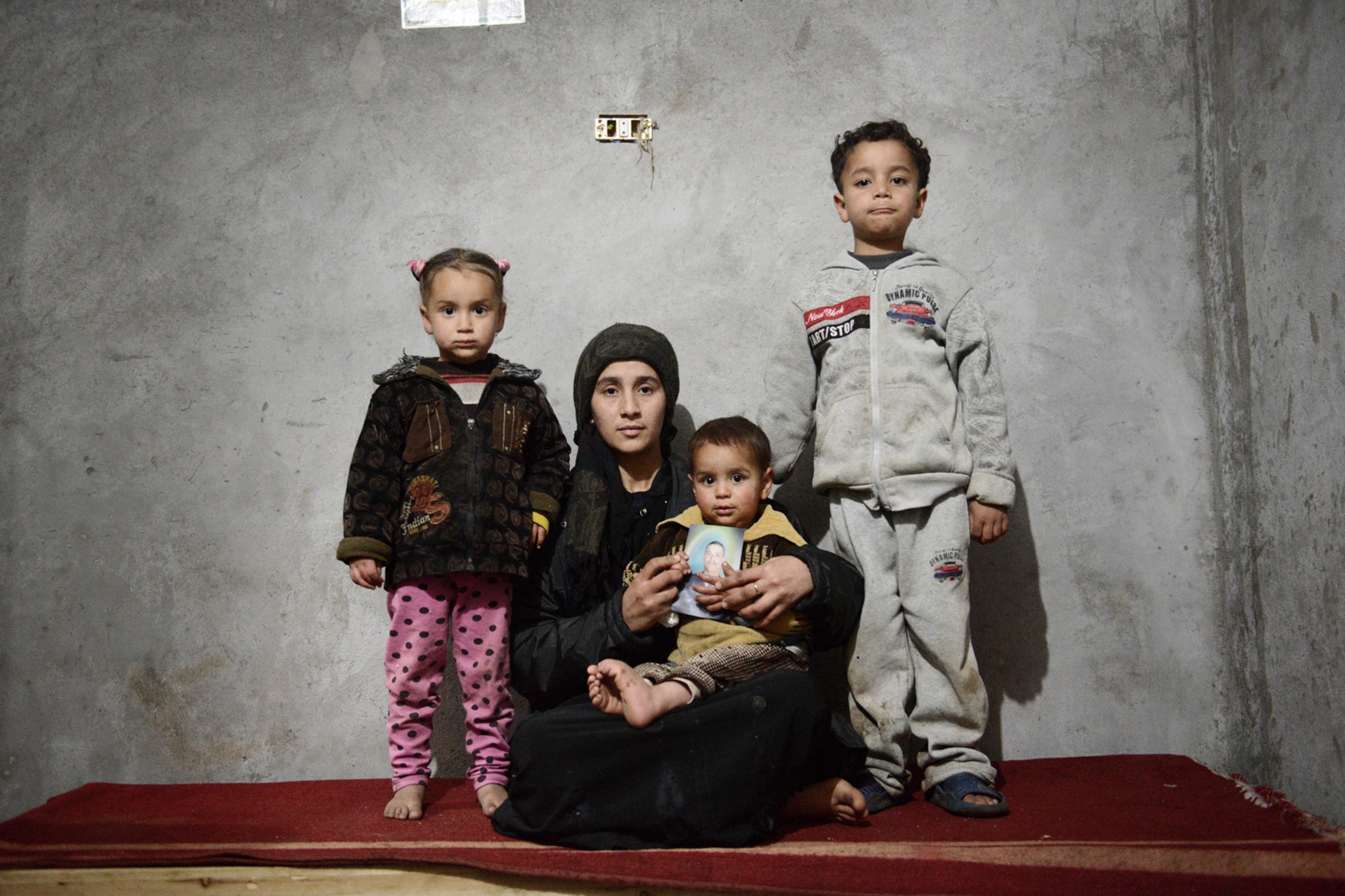 wife, daughter and sons of 29-year-old slain laborer Samuel Abraham