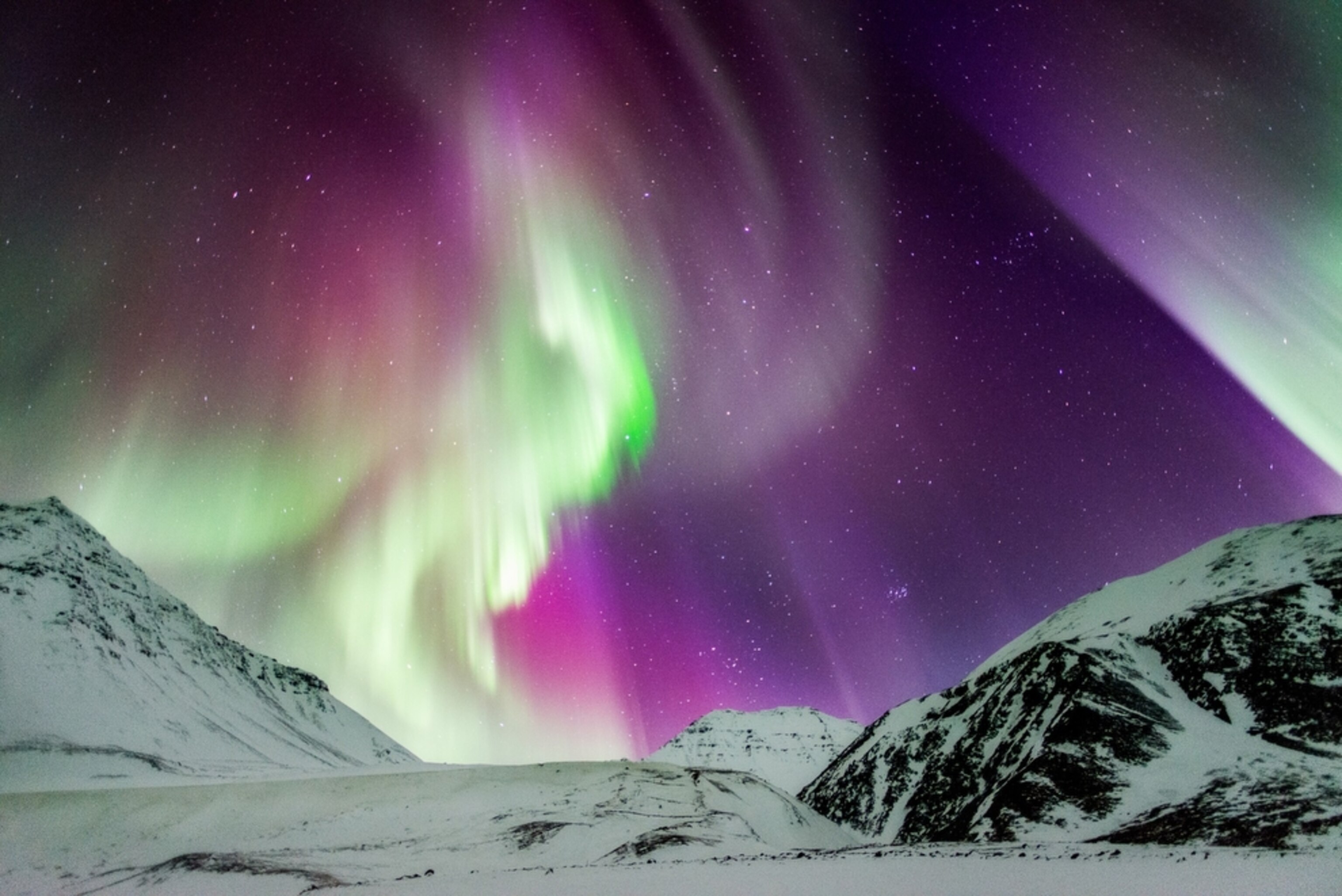 an aurora above Atigun Pass in the Brooks Range of northern Alaska
