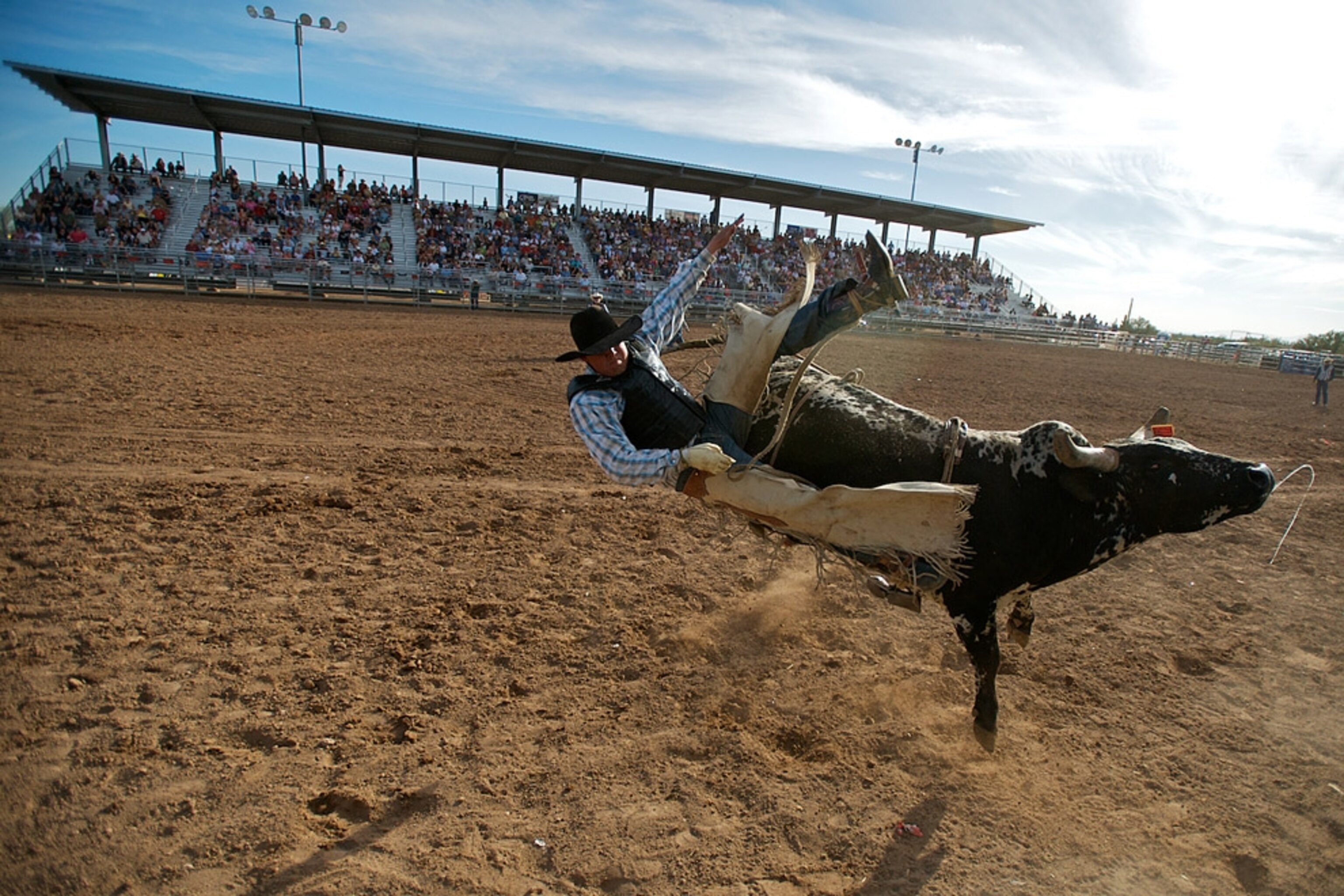 A rider being thrown from a bull