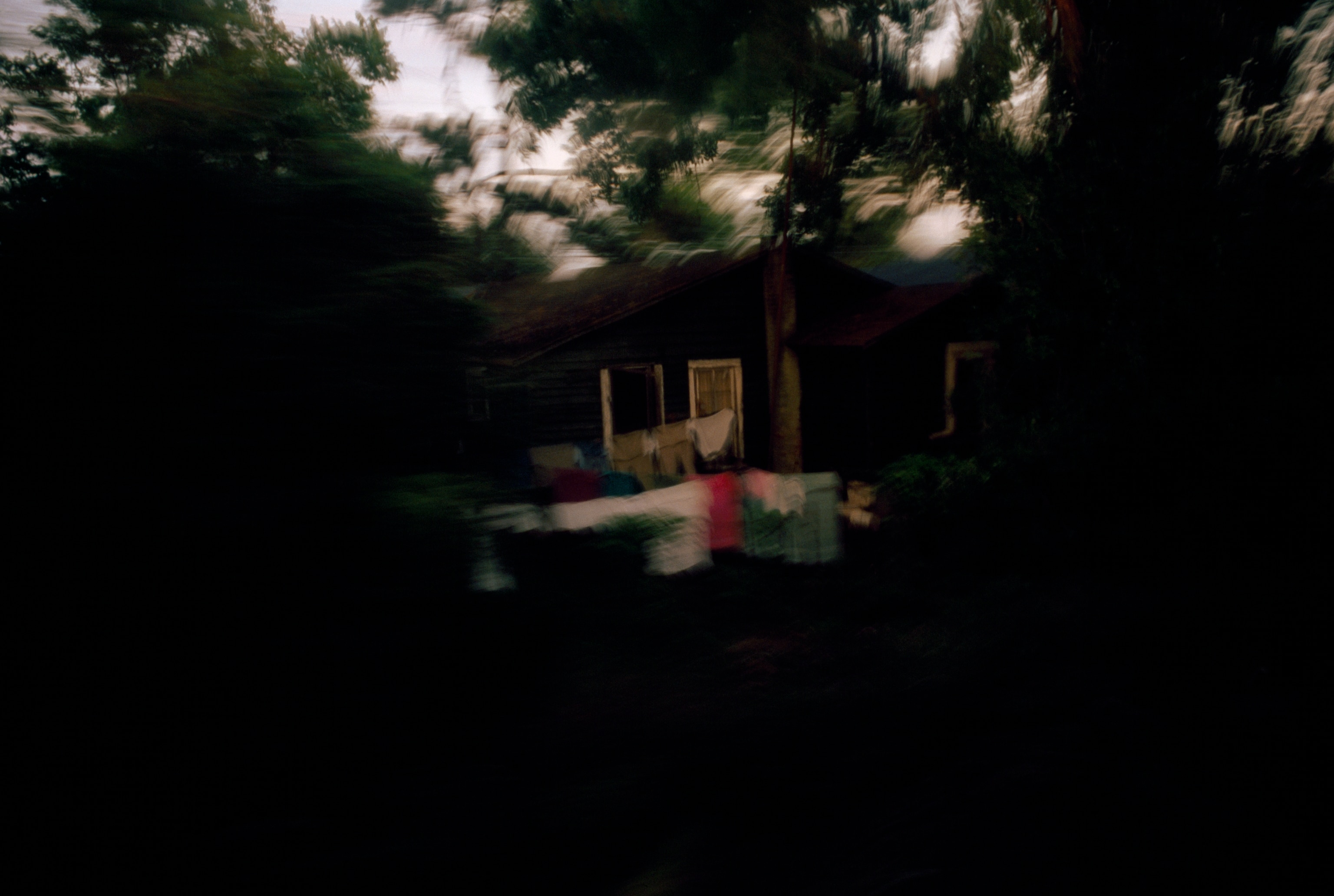 Backyards flit by in a blur seen from a train highballing it to Chicago. The Illinois Central was a steel highway for those seeking to leave the hardscrabble life exemplified by a store in Clarksdale, Mississippi.