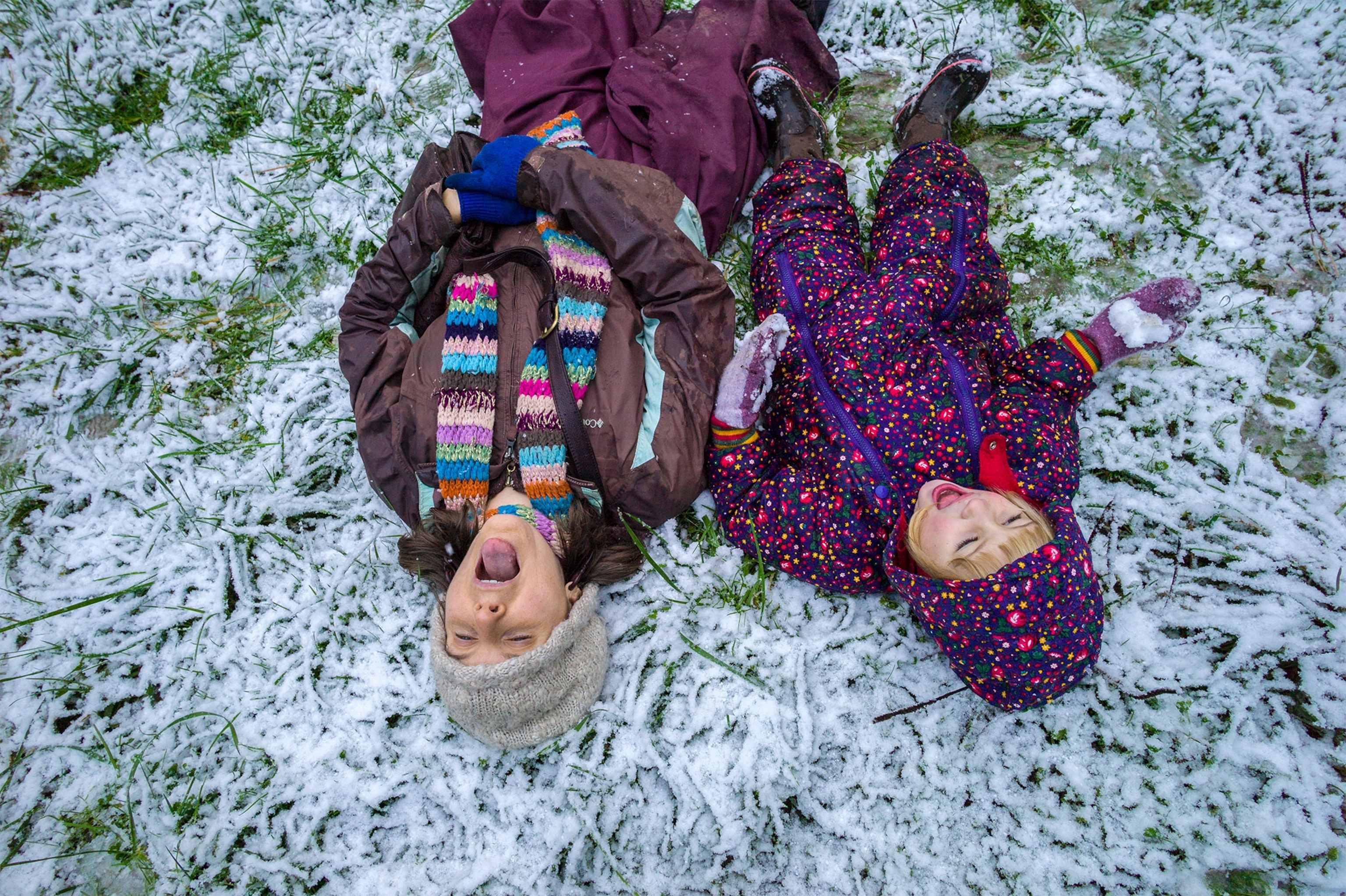 two kids playing in the snow