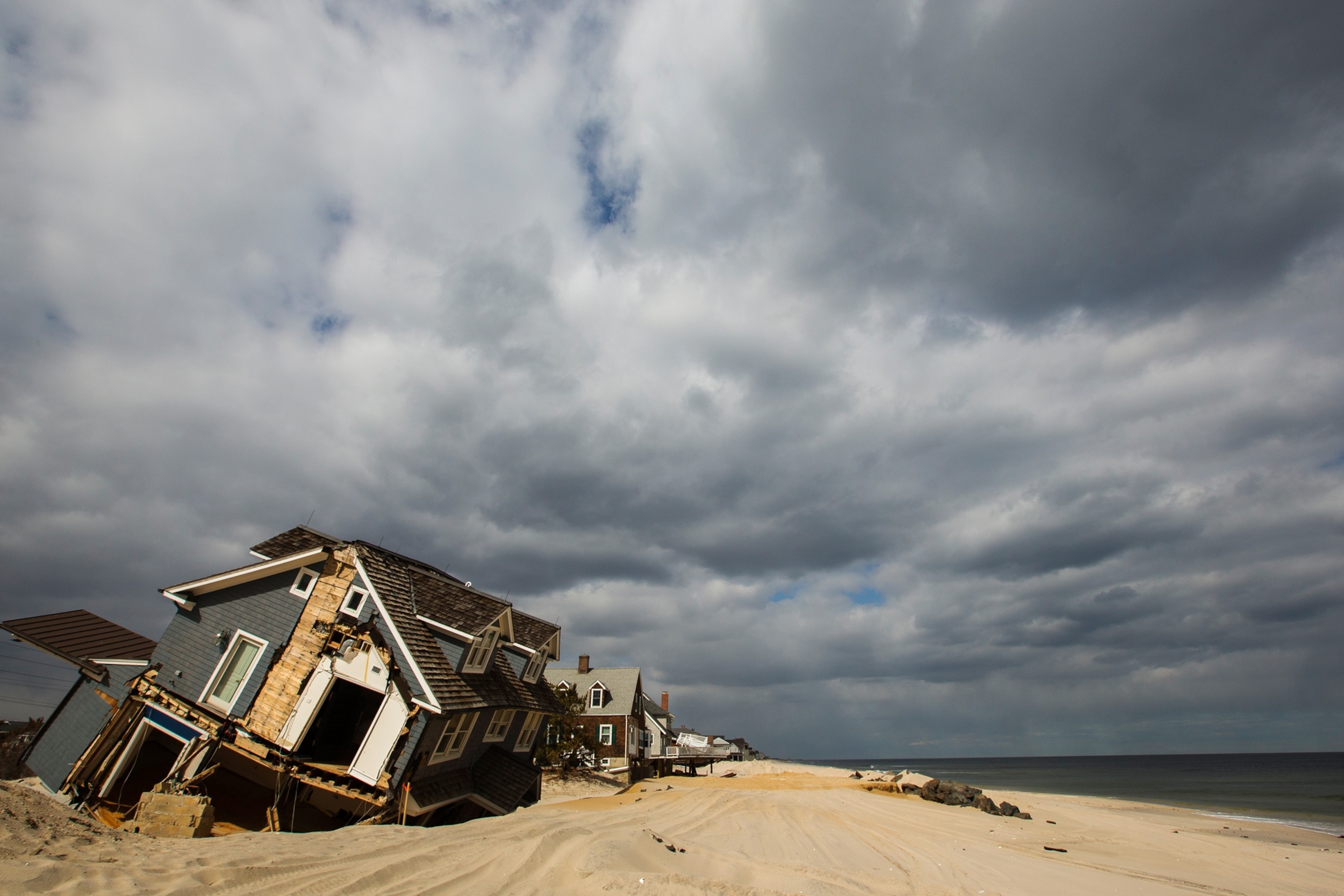 A journalist walks in Atlantic City, New Jersey, the United States, Oct. 29, 2012, when the hurricane Sandy was churning its way towards the U.S. East Coast.