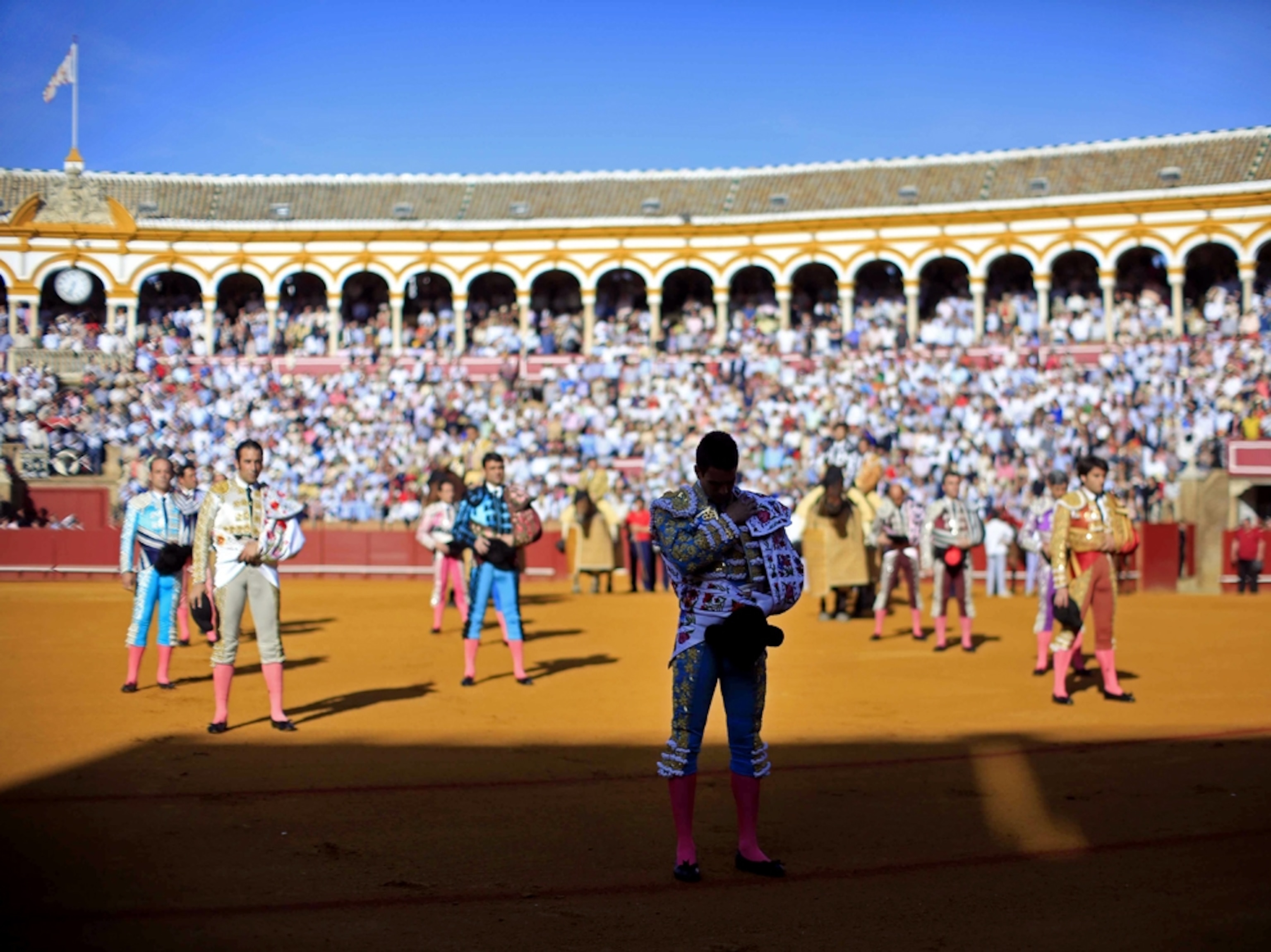 a matador and his assistants before a bullfight at The Maestranza bullring in Seville, Spain