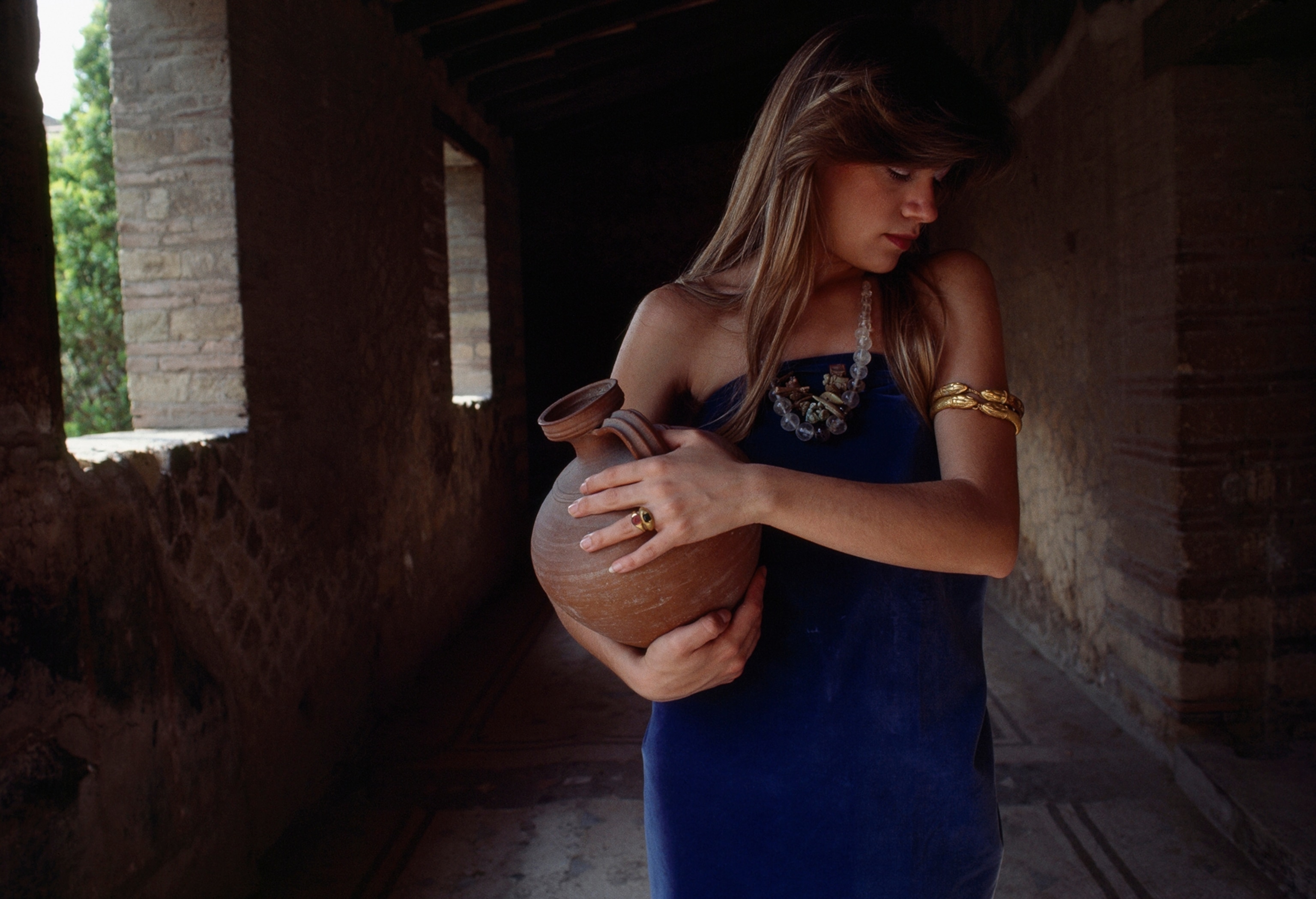 A woman models jewelry found in the ruins of ancient Herculaneum.