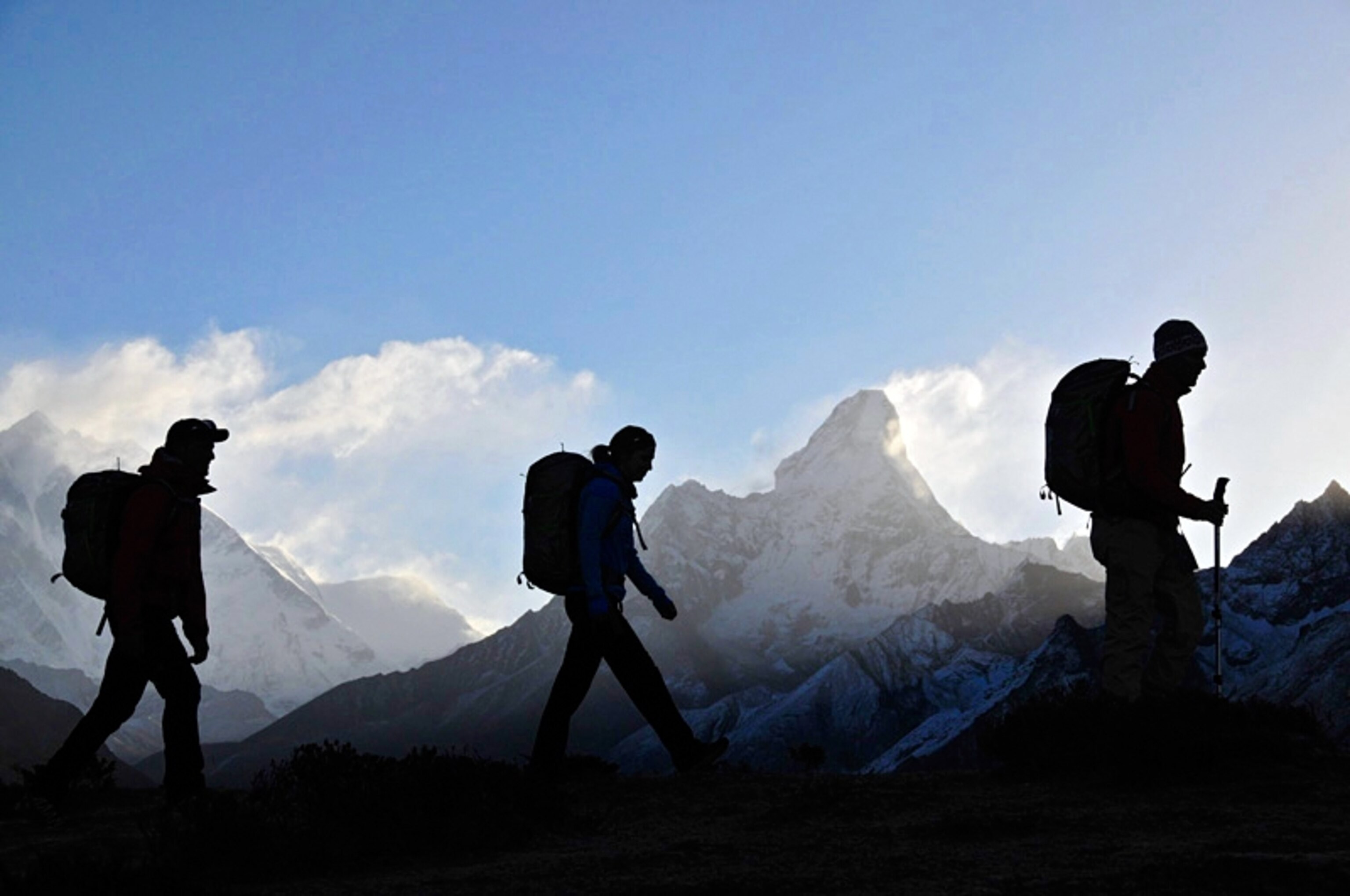 Peter Whittaker, Melissa Arnot, and Seth Waterfall walk along the Syangboche Ridge