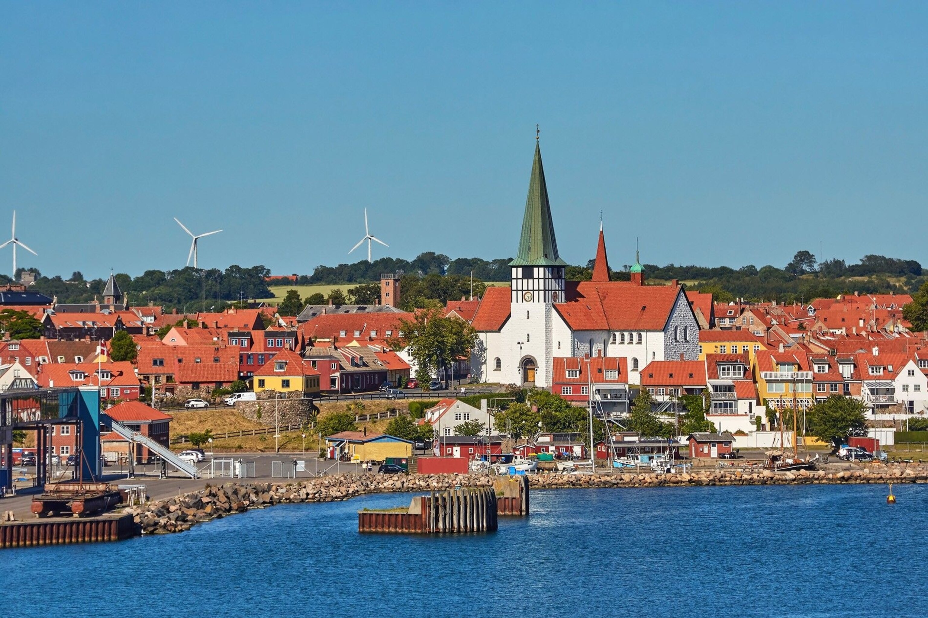 The colourful houses of Bornholm island in Denmark, viewed from a boat.