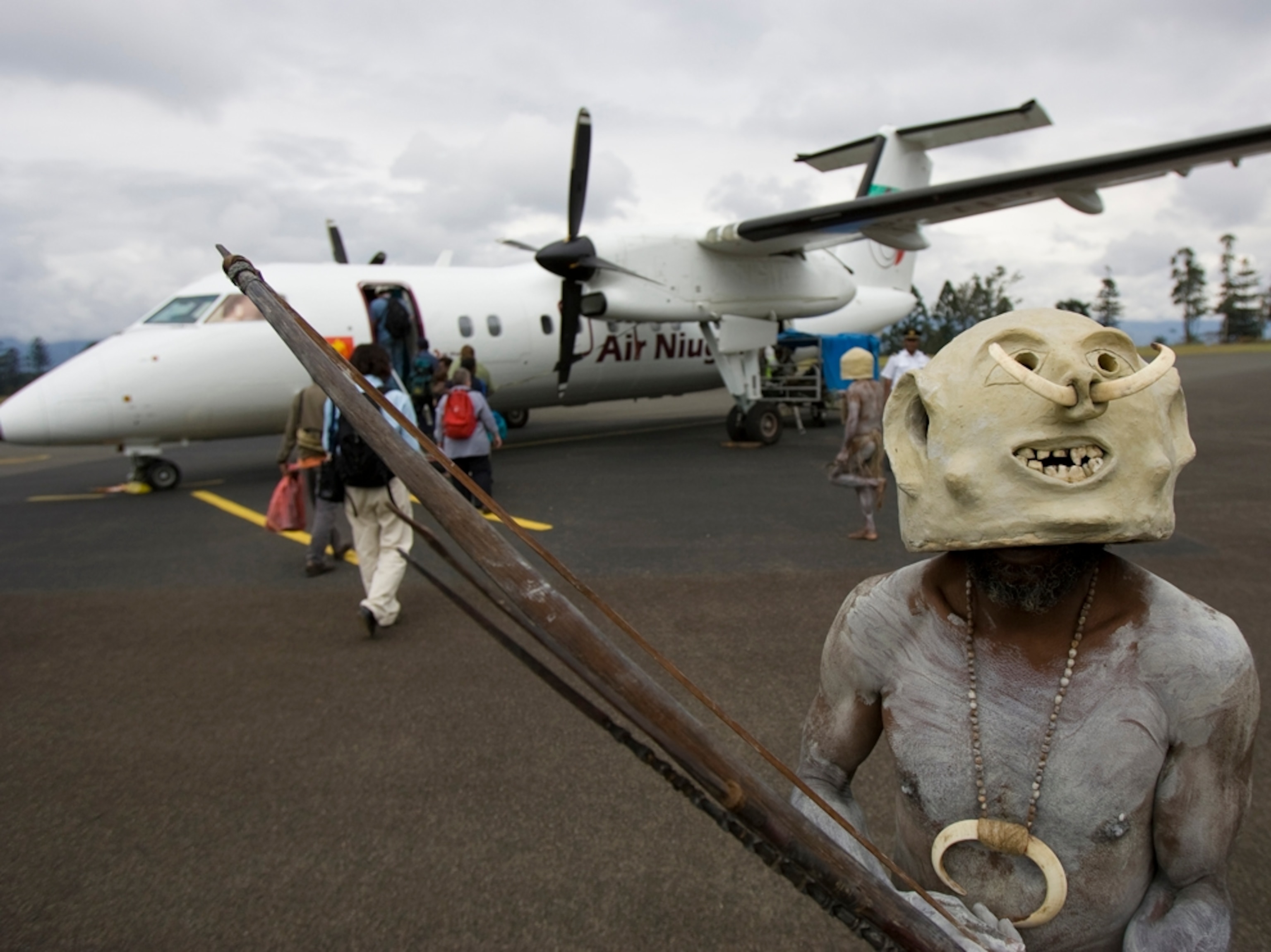 a mudman at an airport